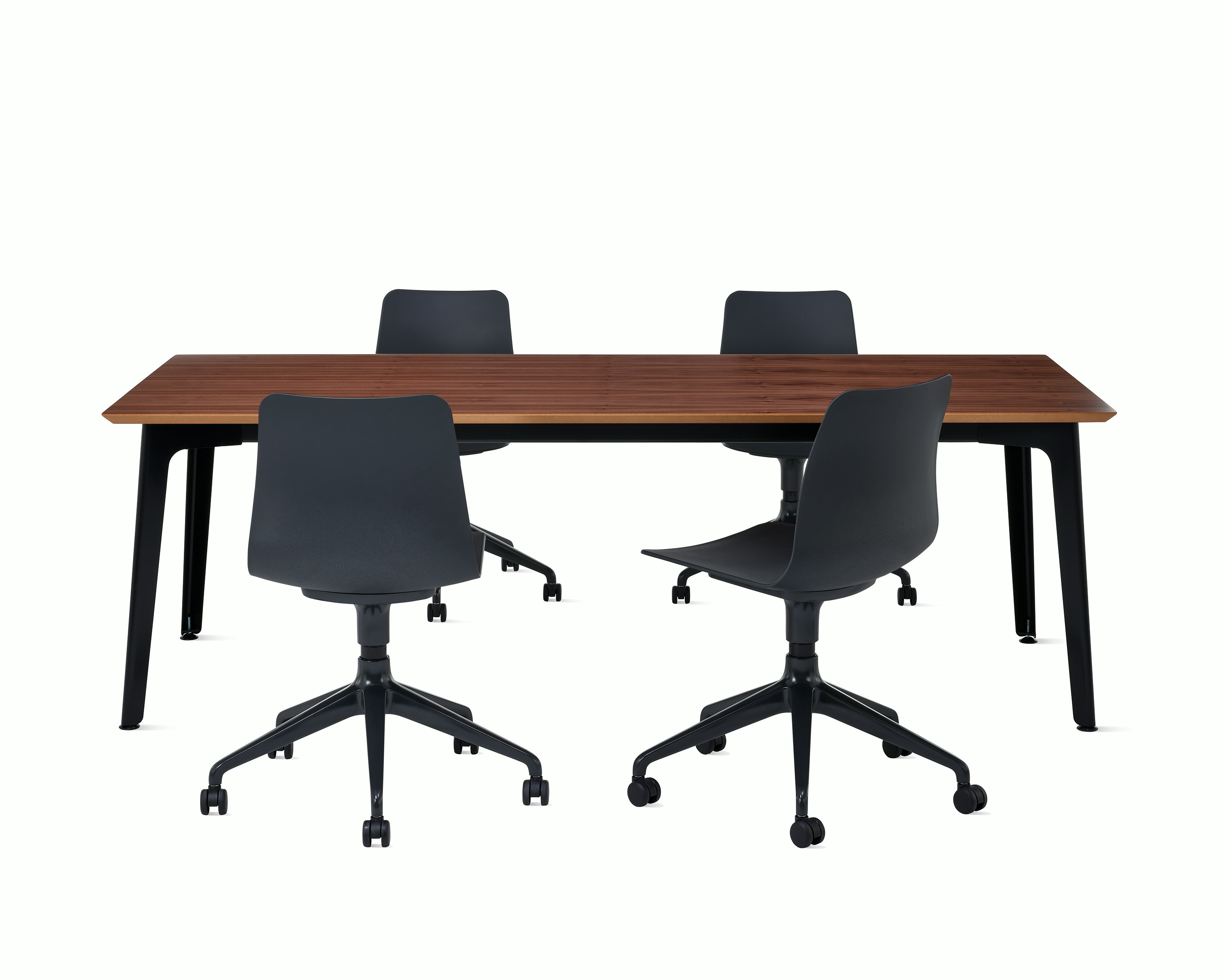 Two black Polly 5 star chairs around a Fold conference table with black steel base and walnut veneer top.