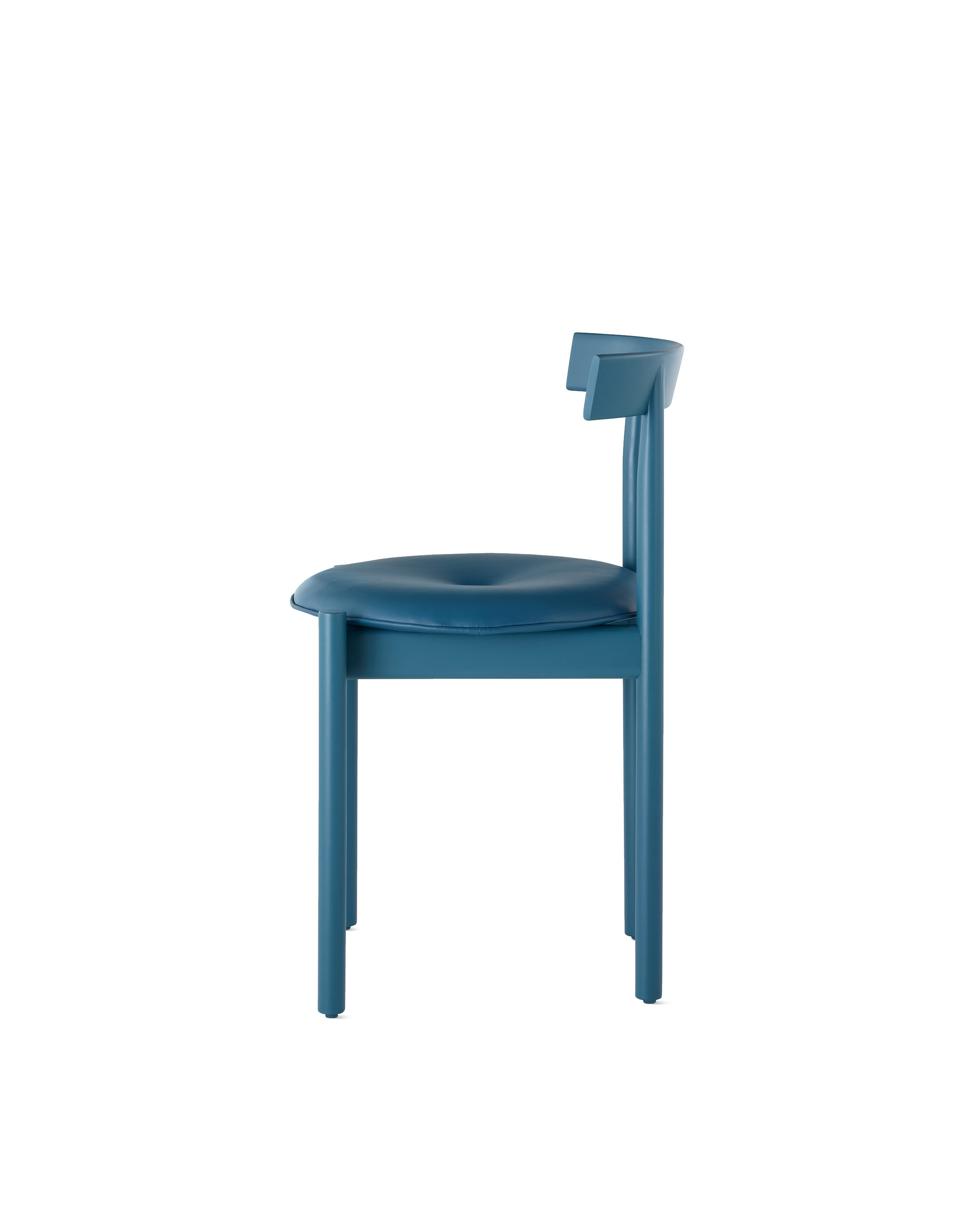 Profile view of a blue Comma Chair with a seat pad.