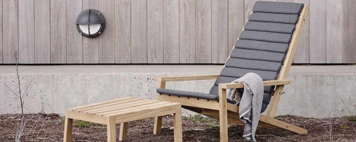 Between Lines Deck Chair and Cushion in outdoor setting