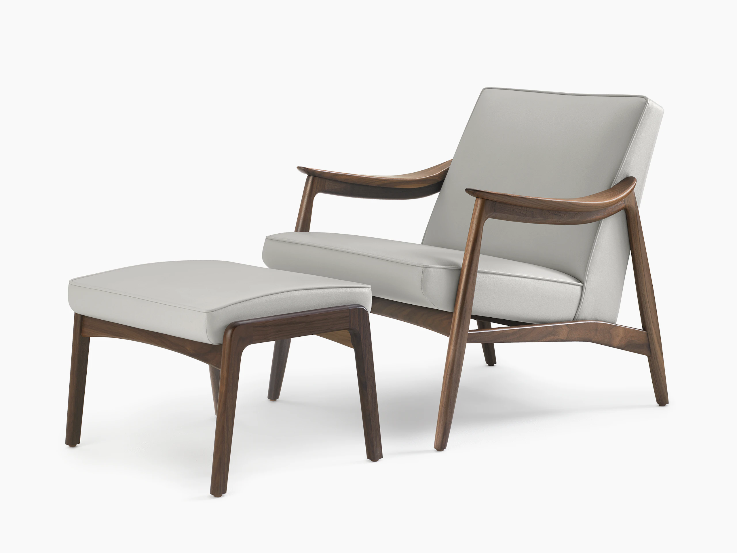 An Aspen Lounge Chair and Ottoman in a gray textile with walnut base and arms.