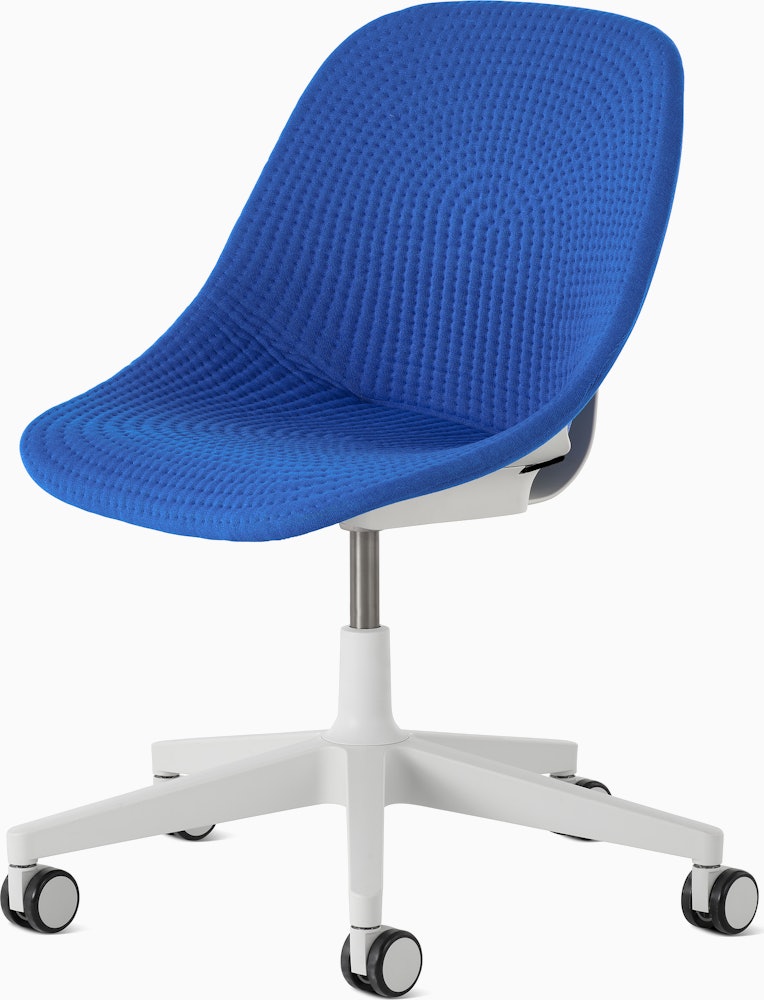 Front angle view of a Zeph chair with no arms in light grey. with a Depp blue knit cover
