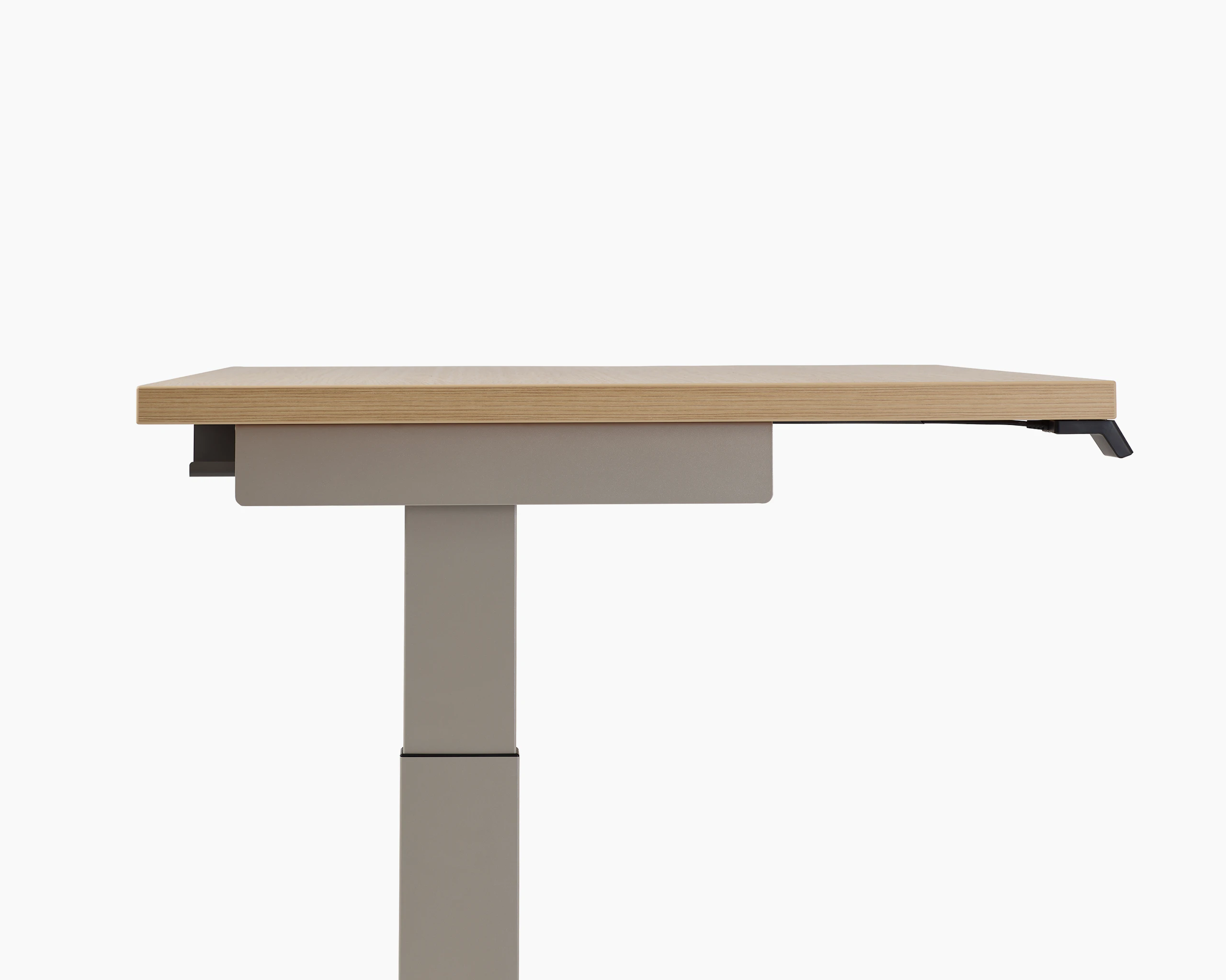 Close-up of Lev Height Adjustable Table with core laminate warm ash
