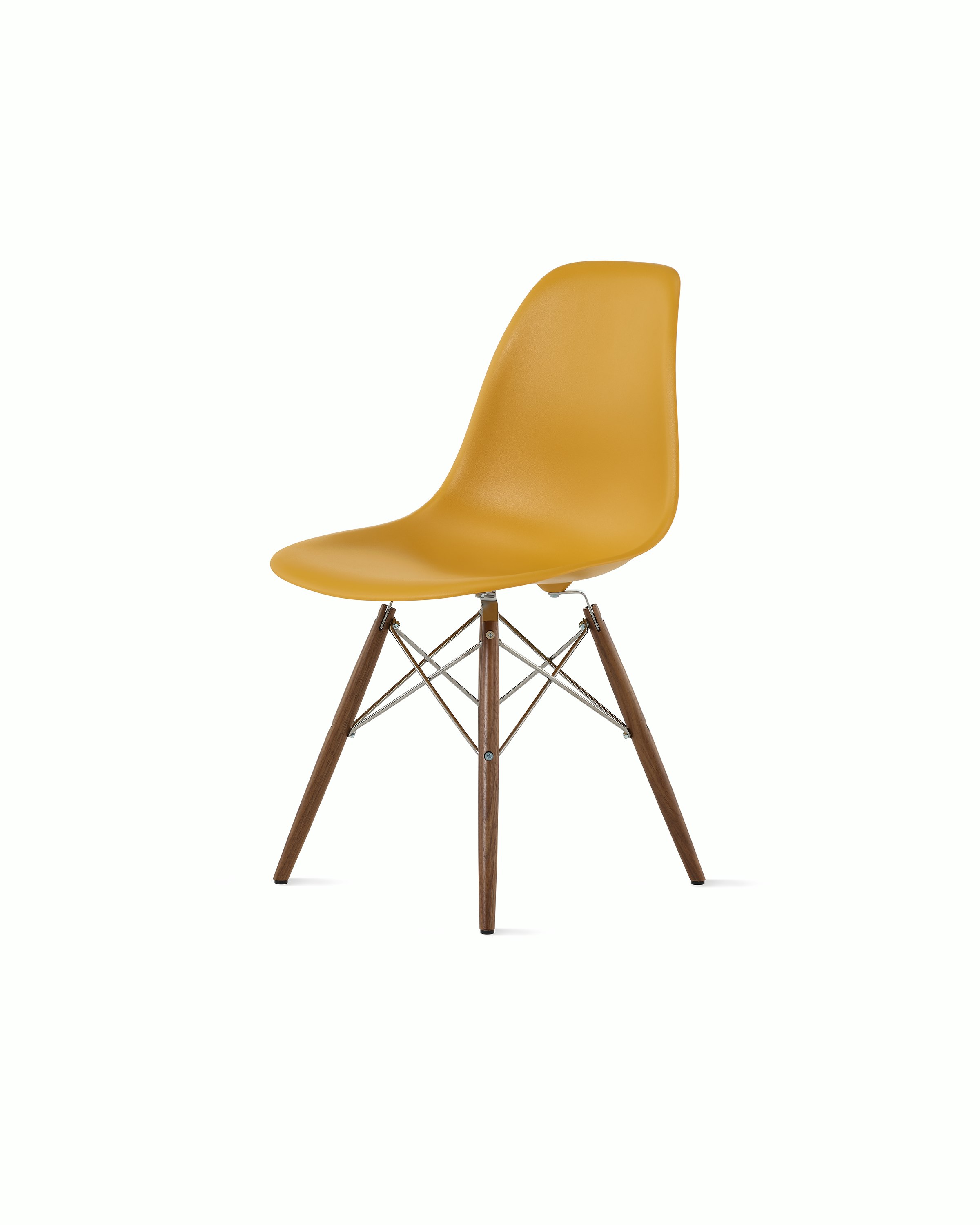 Front of deep yellow plastic shell chair on dowel-base legs.