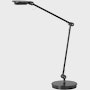A black Tone Personal Light viewed from the side.