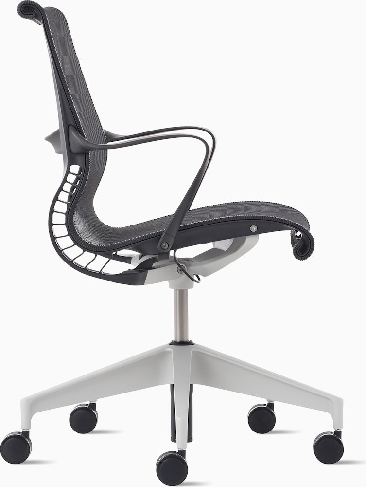 Side view of a Setu chair in dark grey with a silver alloy base.