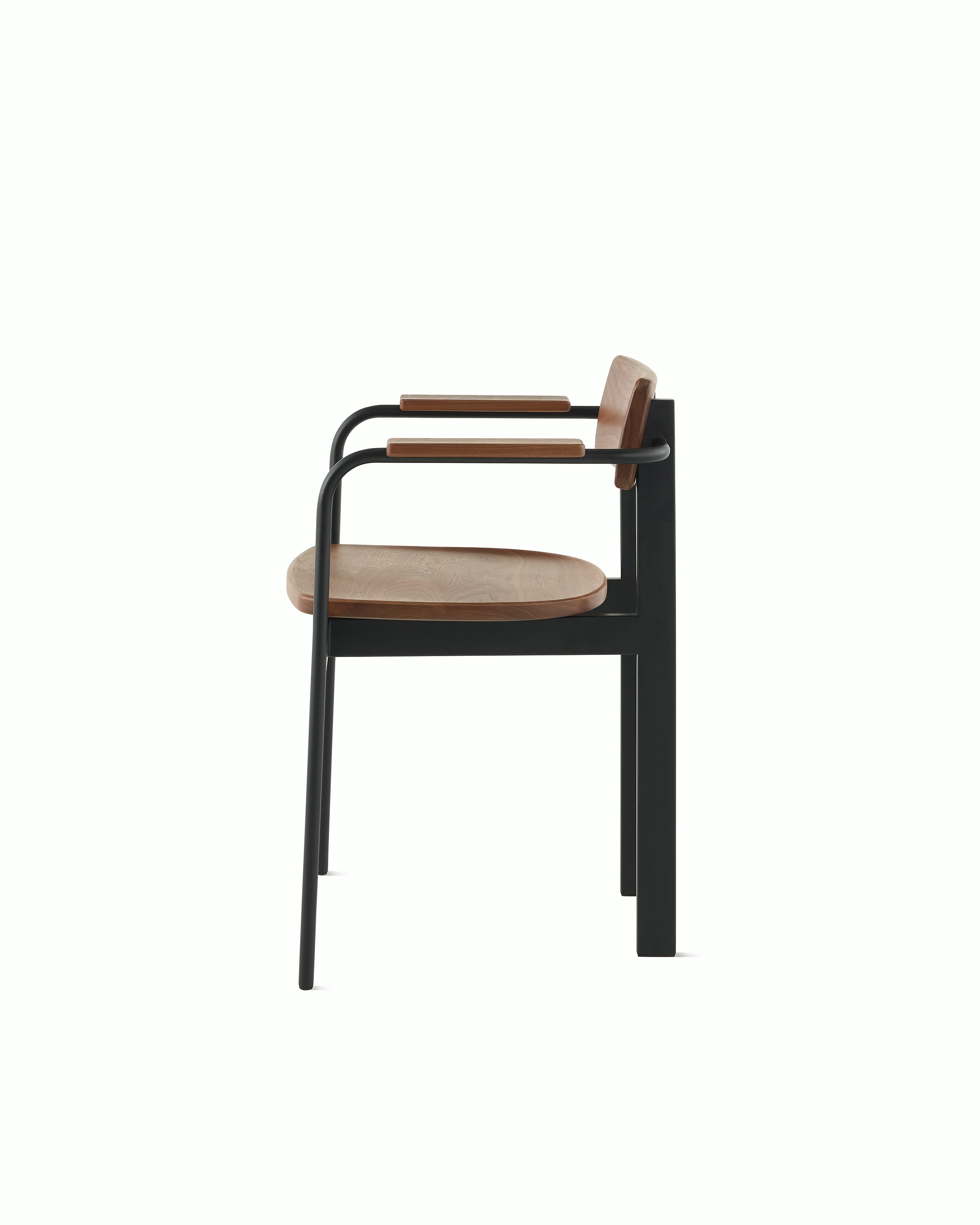 A Betwixt Chair with a walnut backrest, seat, and arms with a black frame.