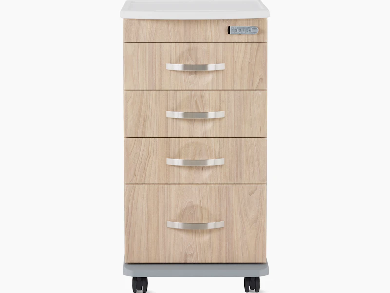 Front view of a Compass casework 4-drawer supply cart in a warm elm finish.