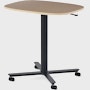 Large Passport Work Table with light woodgrain surface and black base on casters.