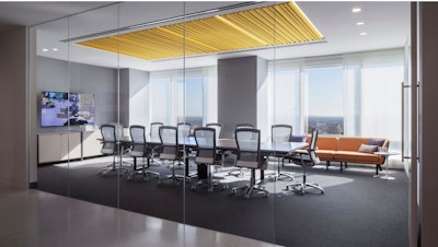A DatesWeiser Highline Conference Table, Knoll Life Chairs, Rockwell Unscripted Modular Lounge, and Saarinen Side Table in a conference room at the Los Angeles showroom