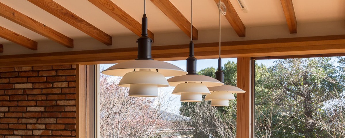 Three PH 3½-3 Colour Pendants hanging from a kitchen ceiling