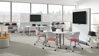 Education setting with mobile seating, project tables, batteries, walls and storage trolleys.
