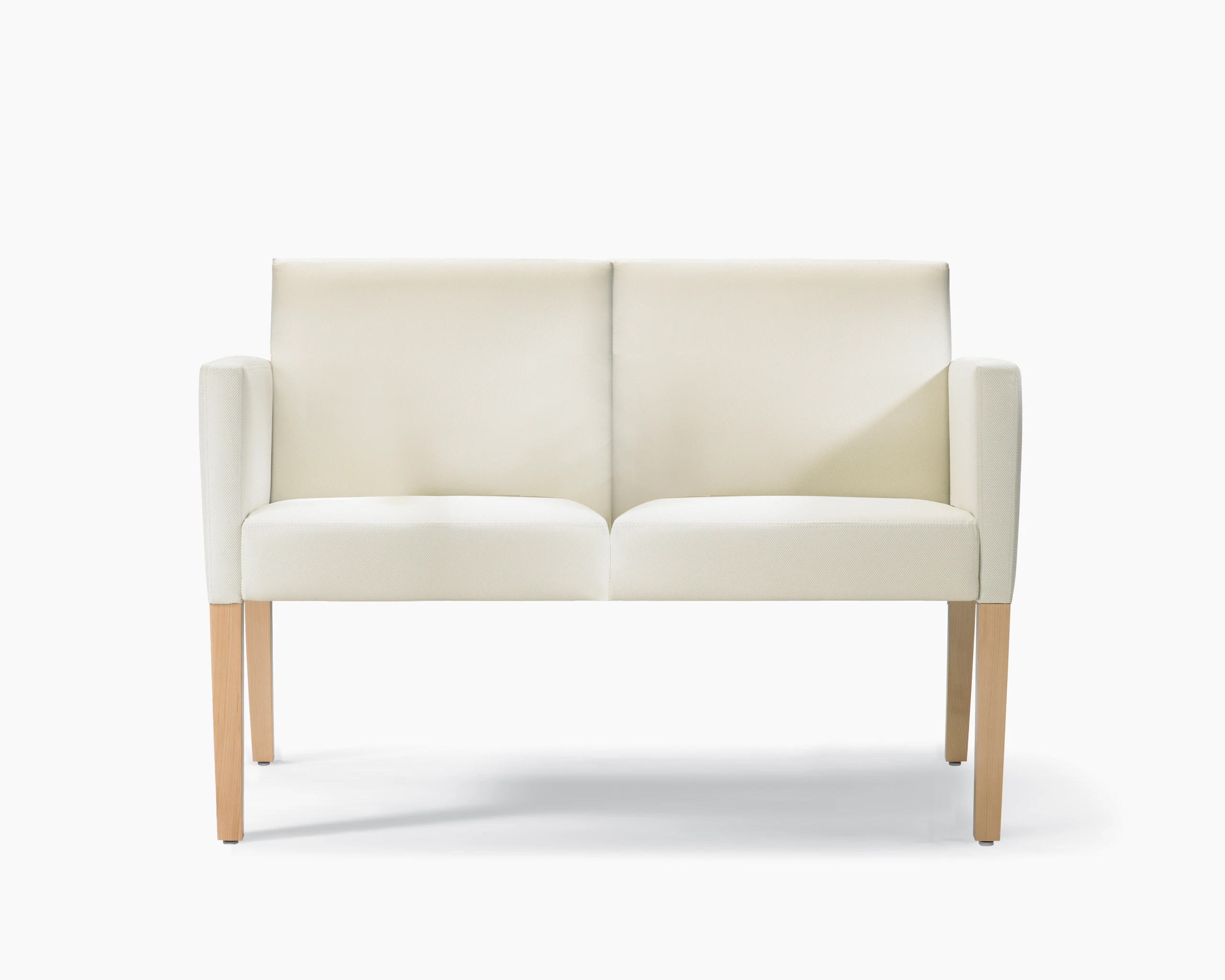 A front view of a Brava 862 Settee in white textile with fully upholstered arms and maple legs.