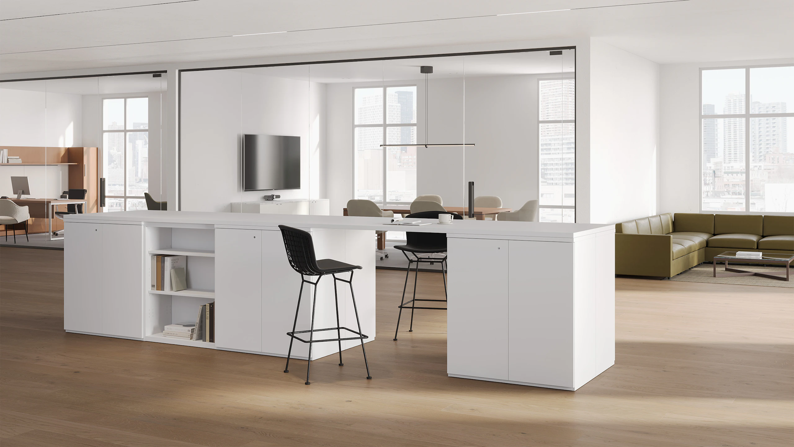 Open office with white Series2 storage cabinets and bookcase in a collaborative setting with two black Bertoia stools.