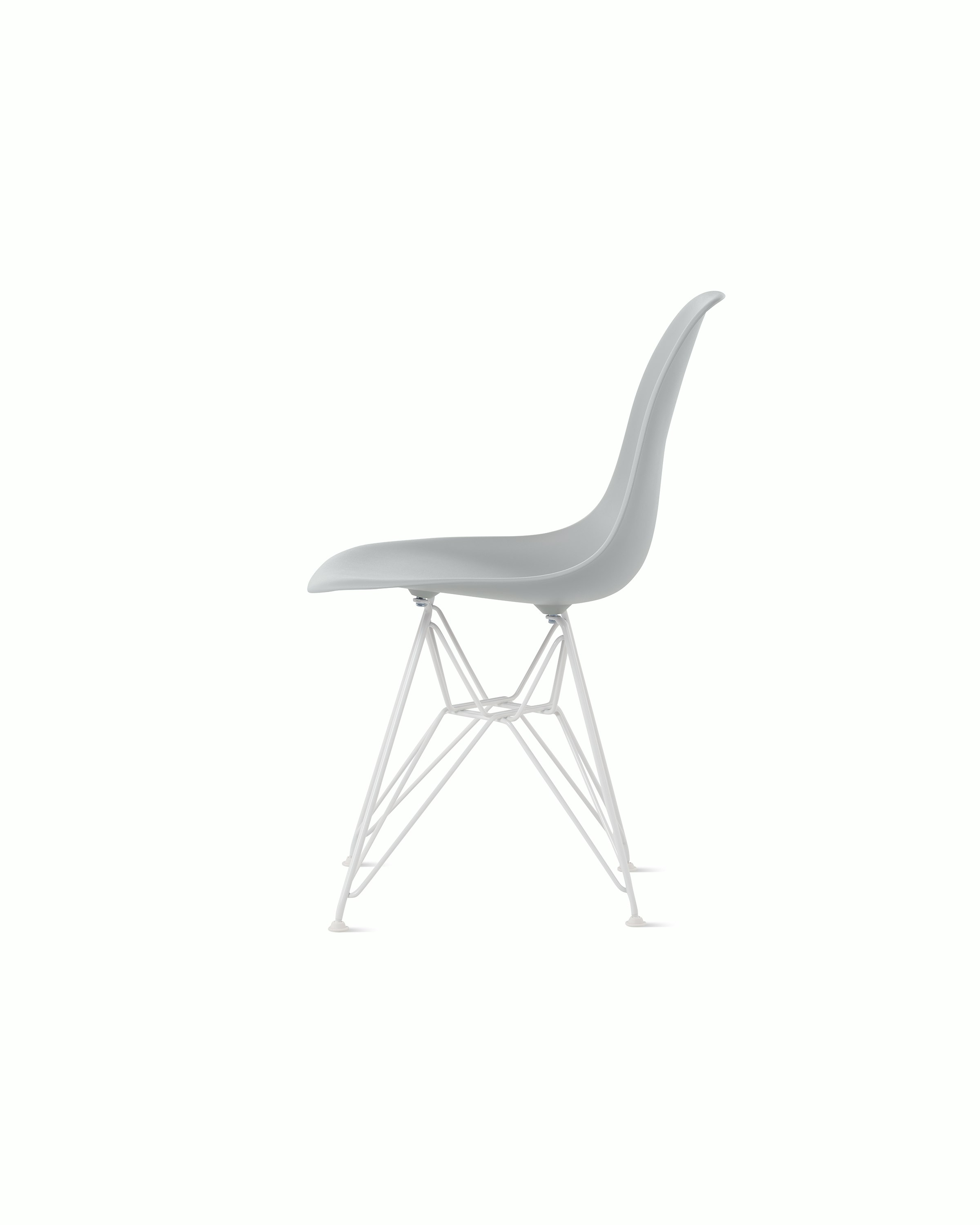 Side of light grey plastic shell chair on wire base.