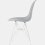 Side of light grey plastic shell chair on wire base.