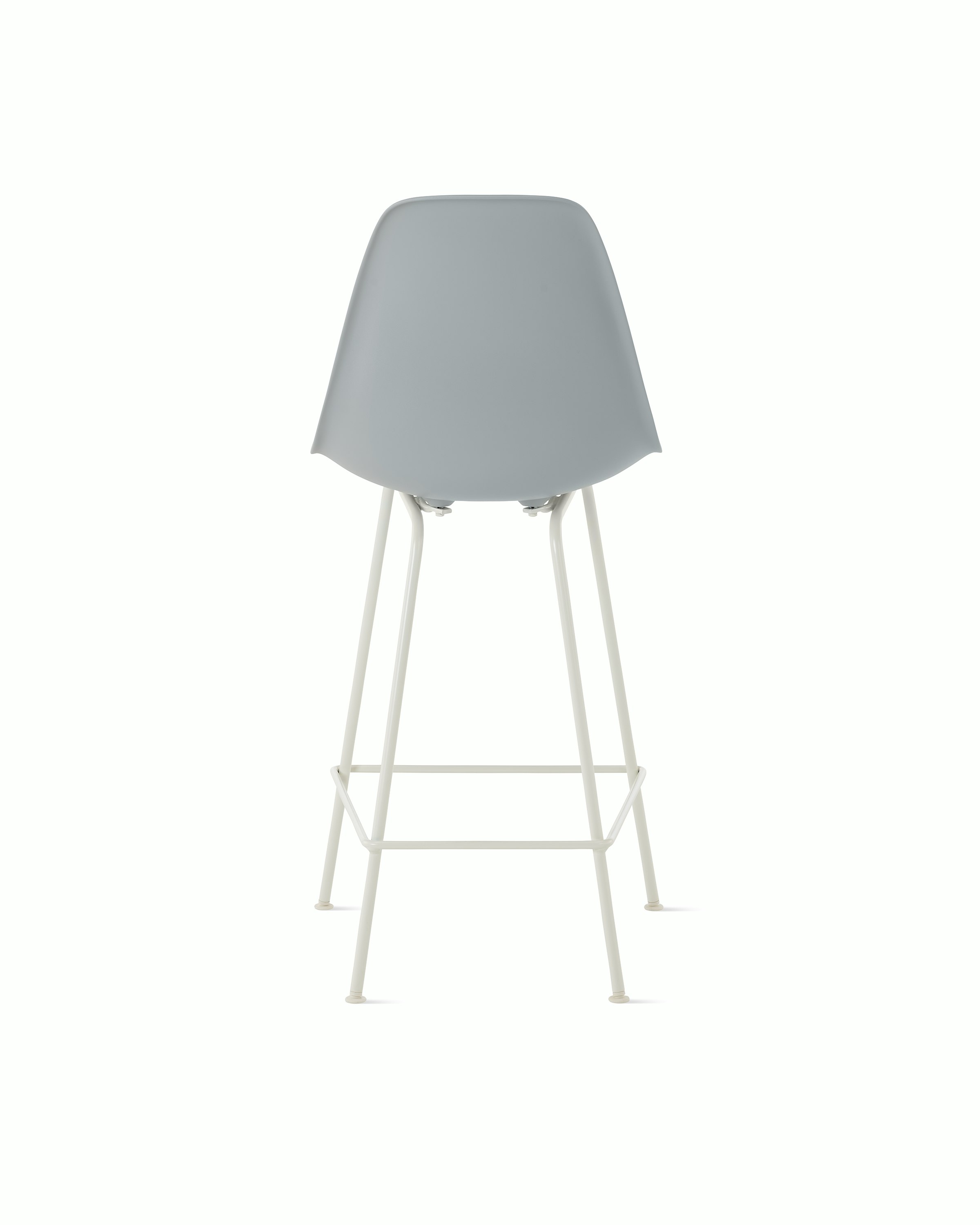 Back of light grey plastic shell stool on 4 leg base.