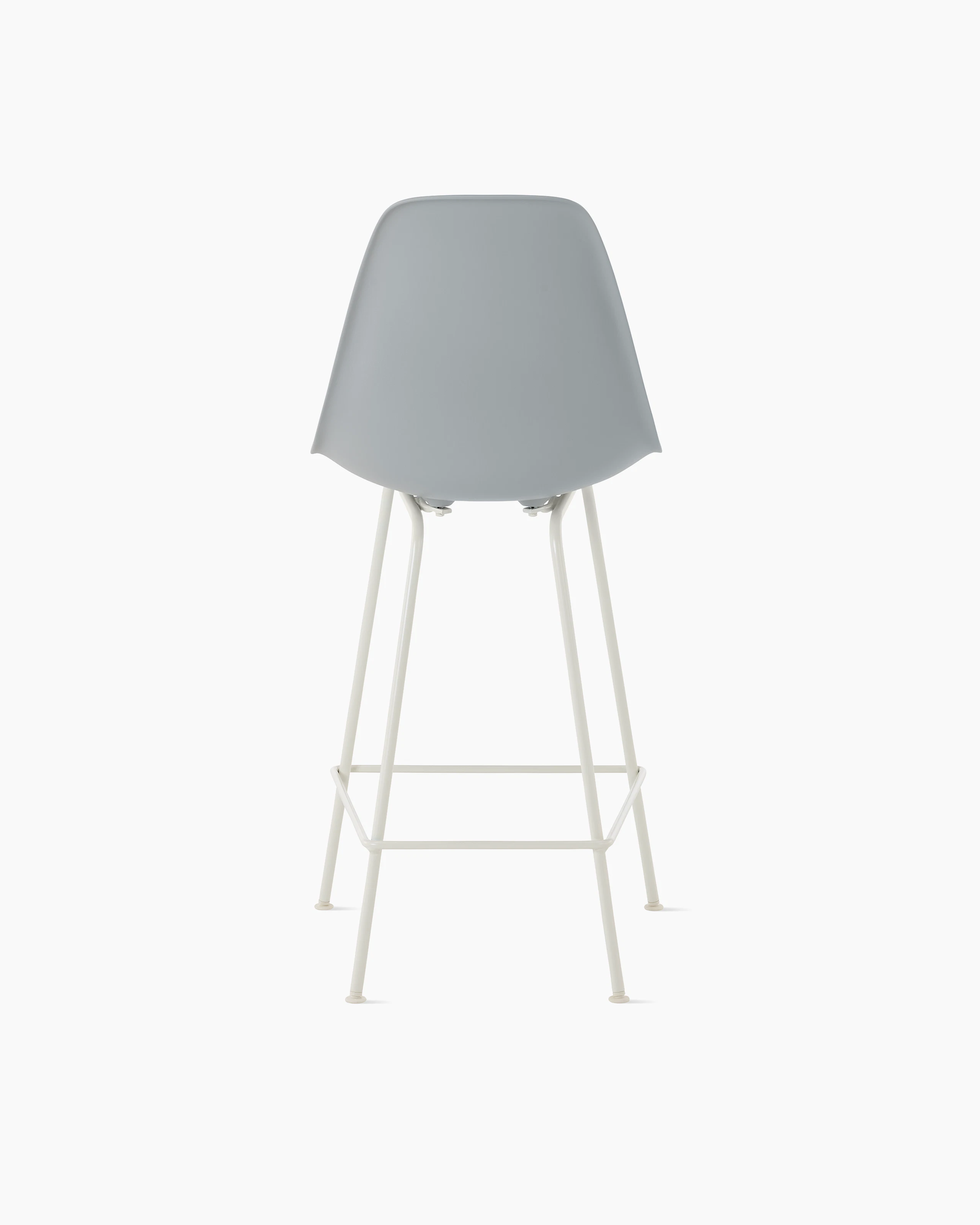 Back of light grey plastic shell stool on 4 leg base.