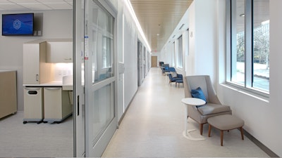 A hallway of exam rooms and chairs at BAMF Health