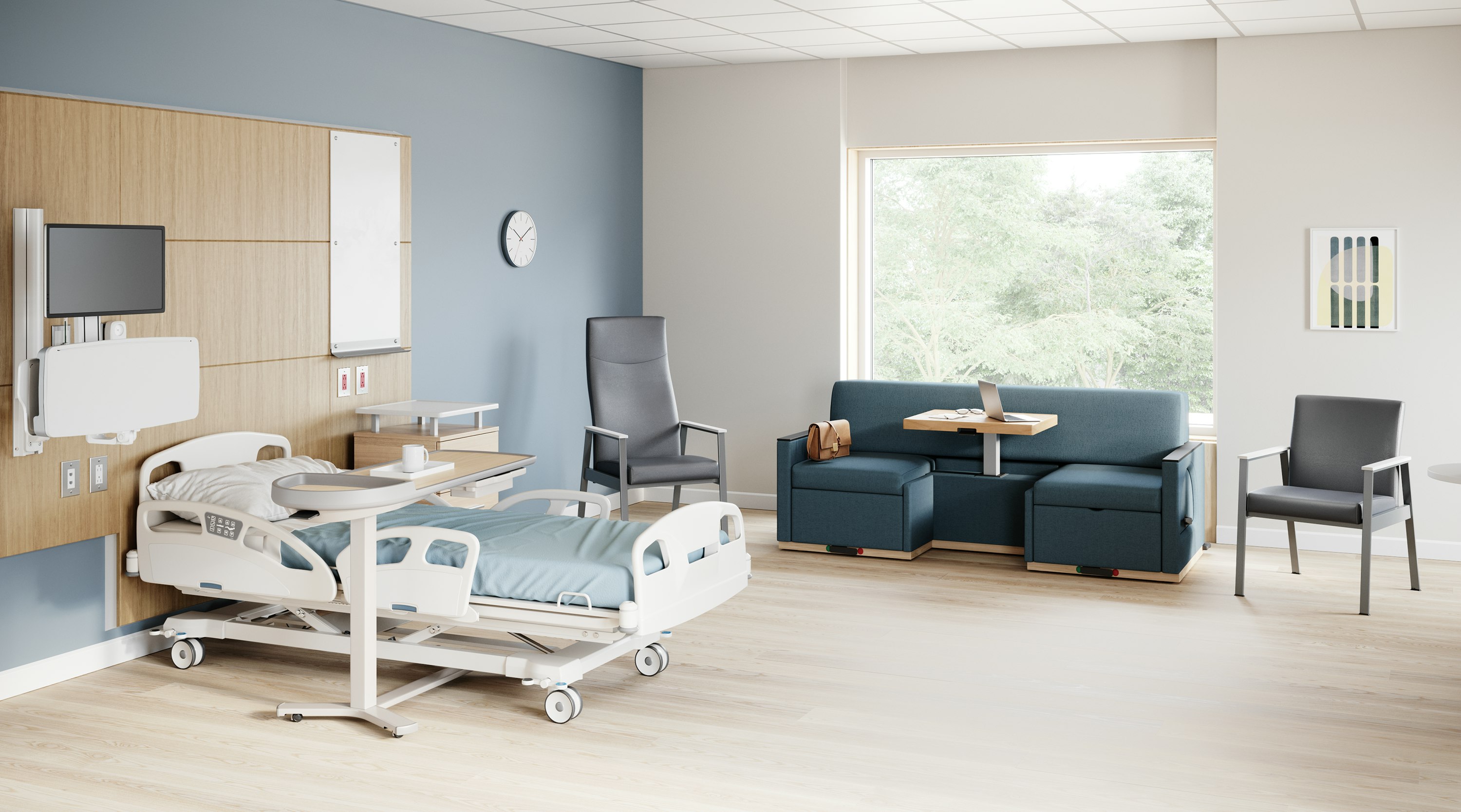 A patient room with an Easton Patient Chair, Side Chairs, Merge 2 Flop Sofa, Compass Casework, Mirage Table and Nemschoff Bedside Cabinet.