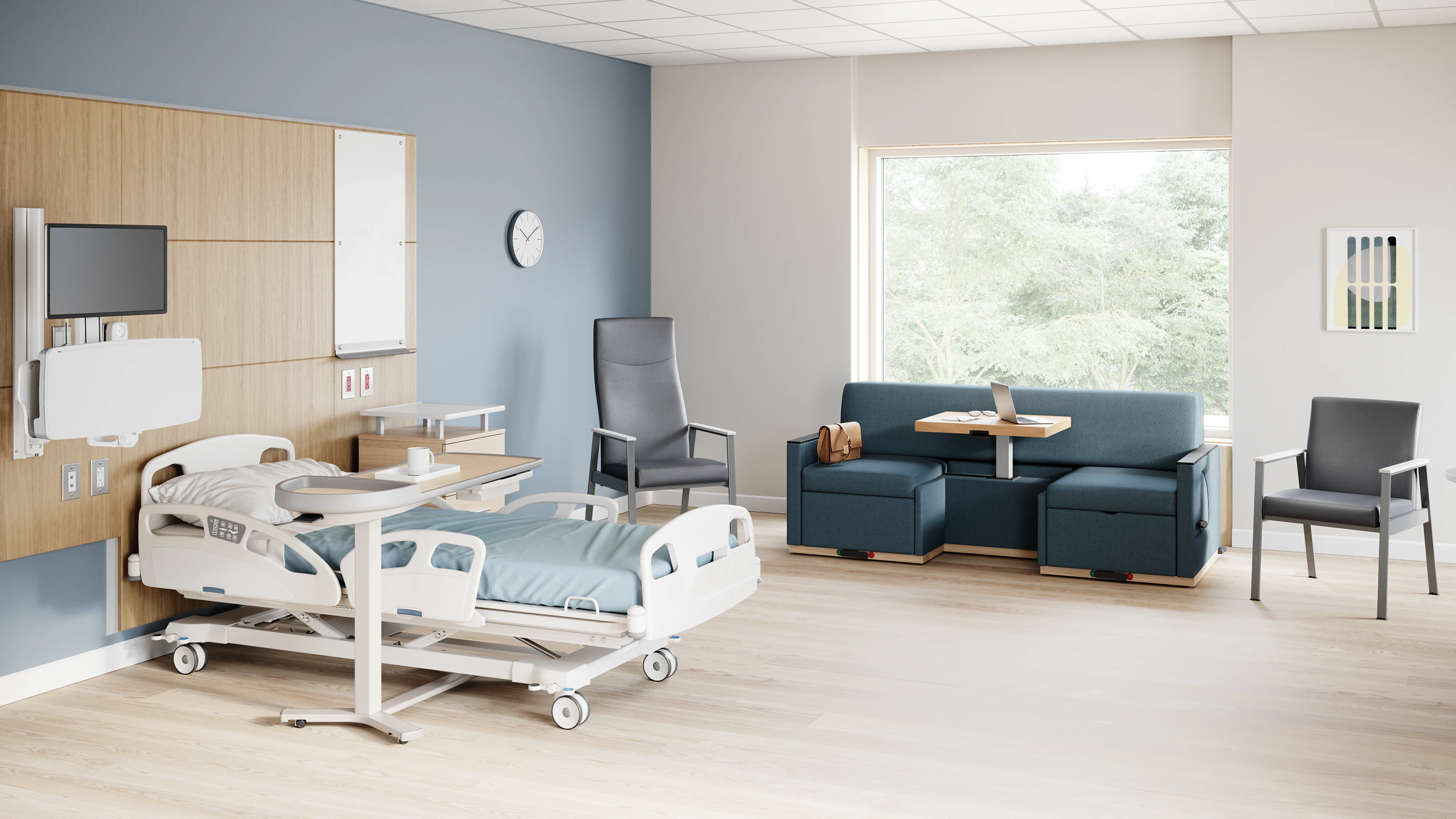 A patient room with an Easton Patient Chair, Side Chairs, Merge 2 Flop Sofa, Compass Casework, Mirage Table and Nemschoff Bedside Cabinet.