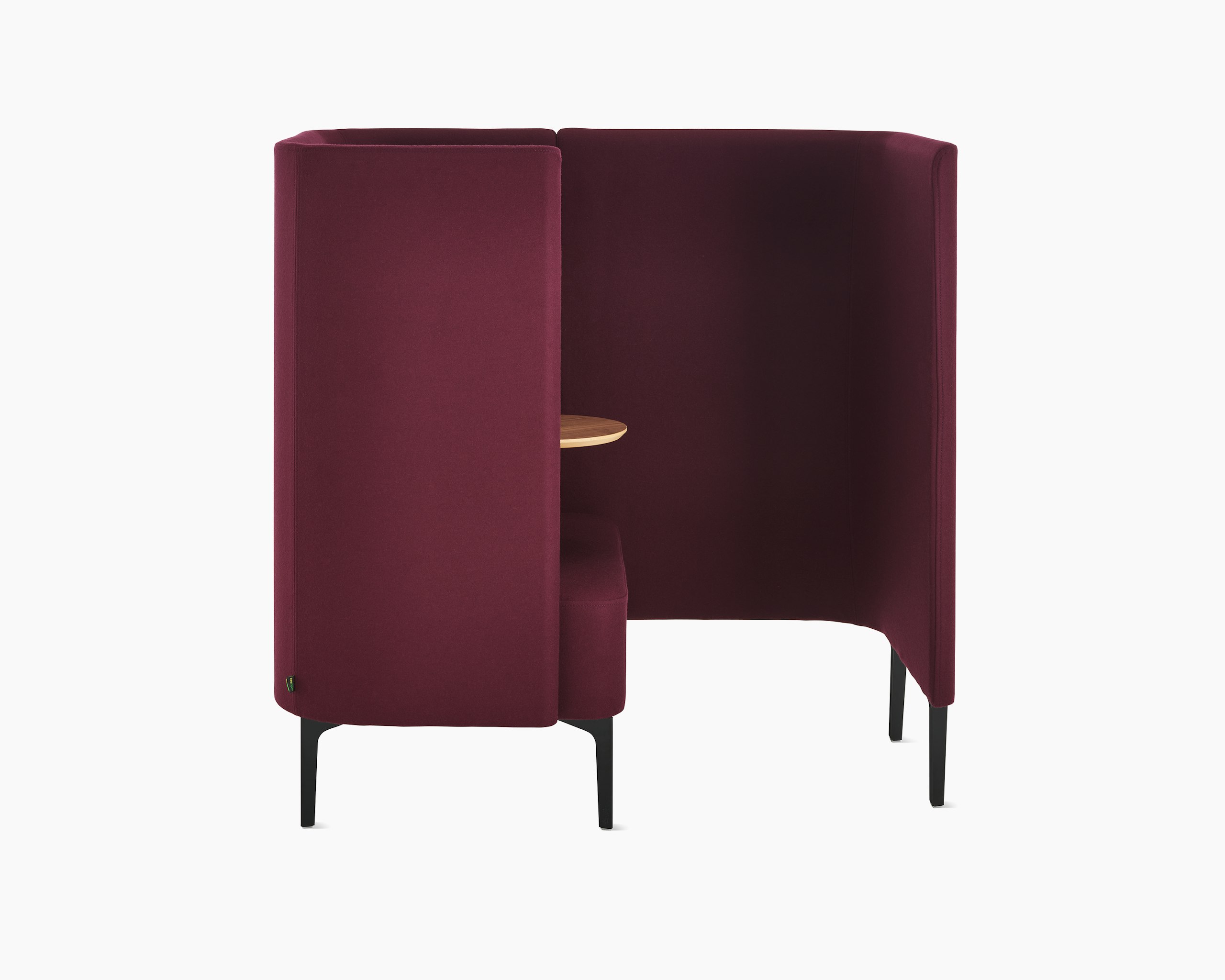 Whitesweep shot of Pullman Chair Pod on black steel legs, upholstered in burgundy fabric with screen left.