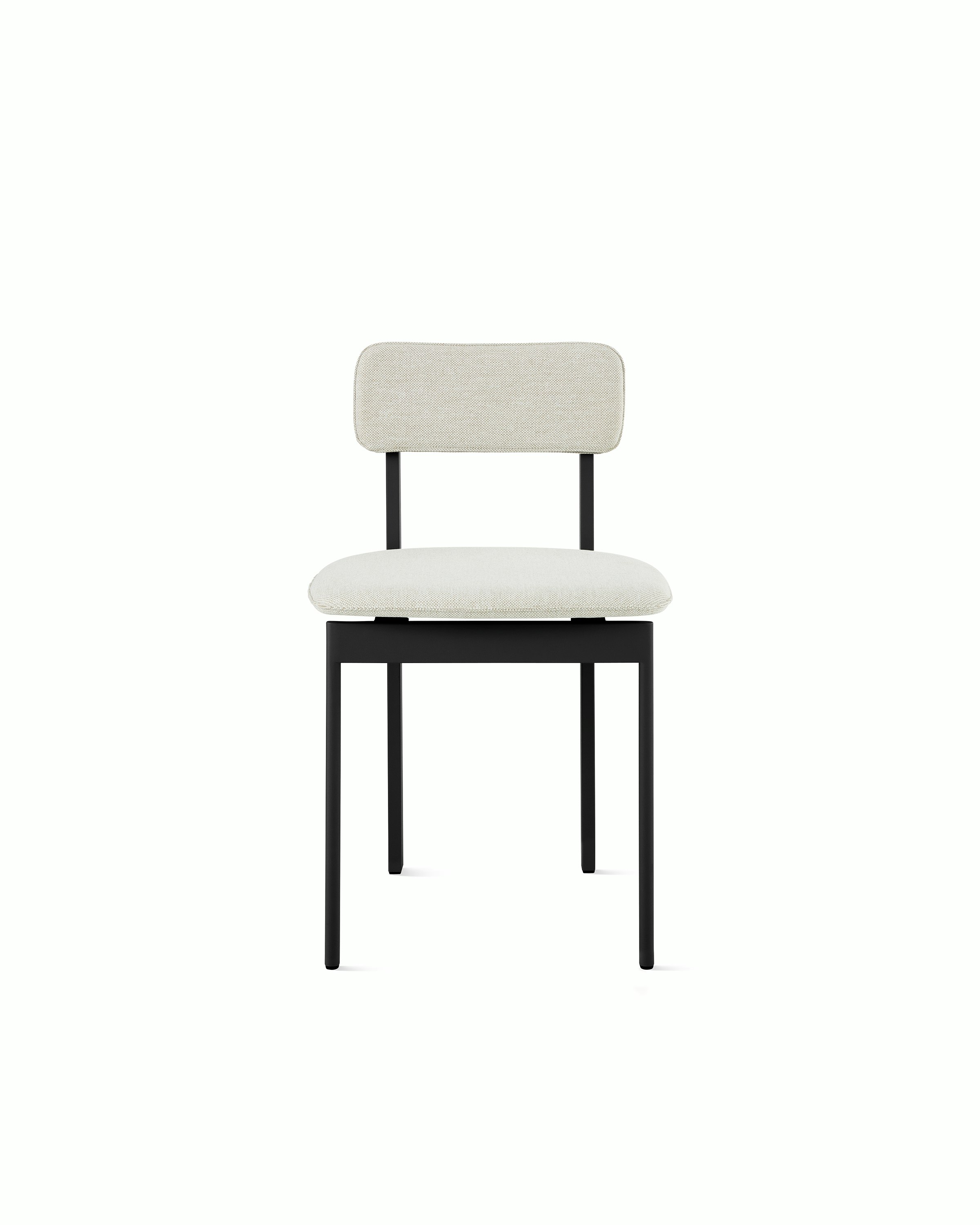 A Betwixt Chair with light grey fabric and a black frame.