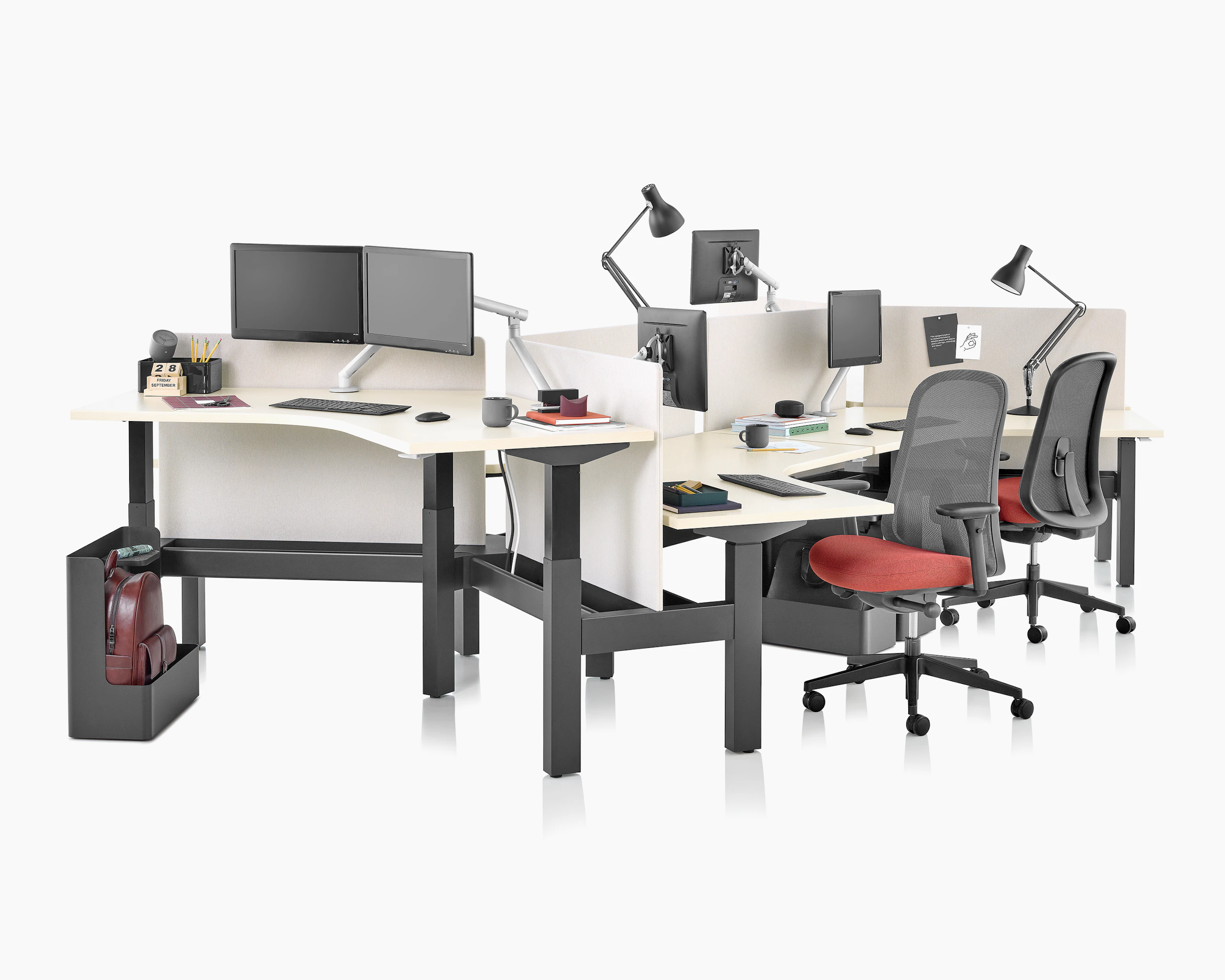 Standing desk system, Nevi Link, with 120-degree work surfaces, Lino Chairs, and screens. Two of the six desks are raised at a standing height.