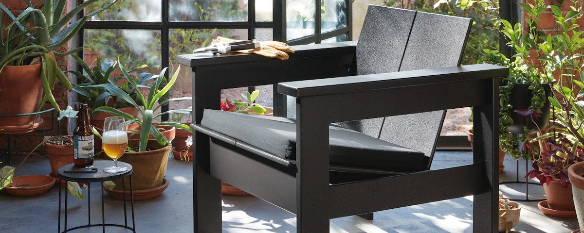 Hennepin lounge chair in a greenhouse atrium