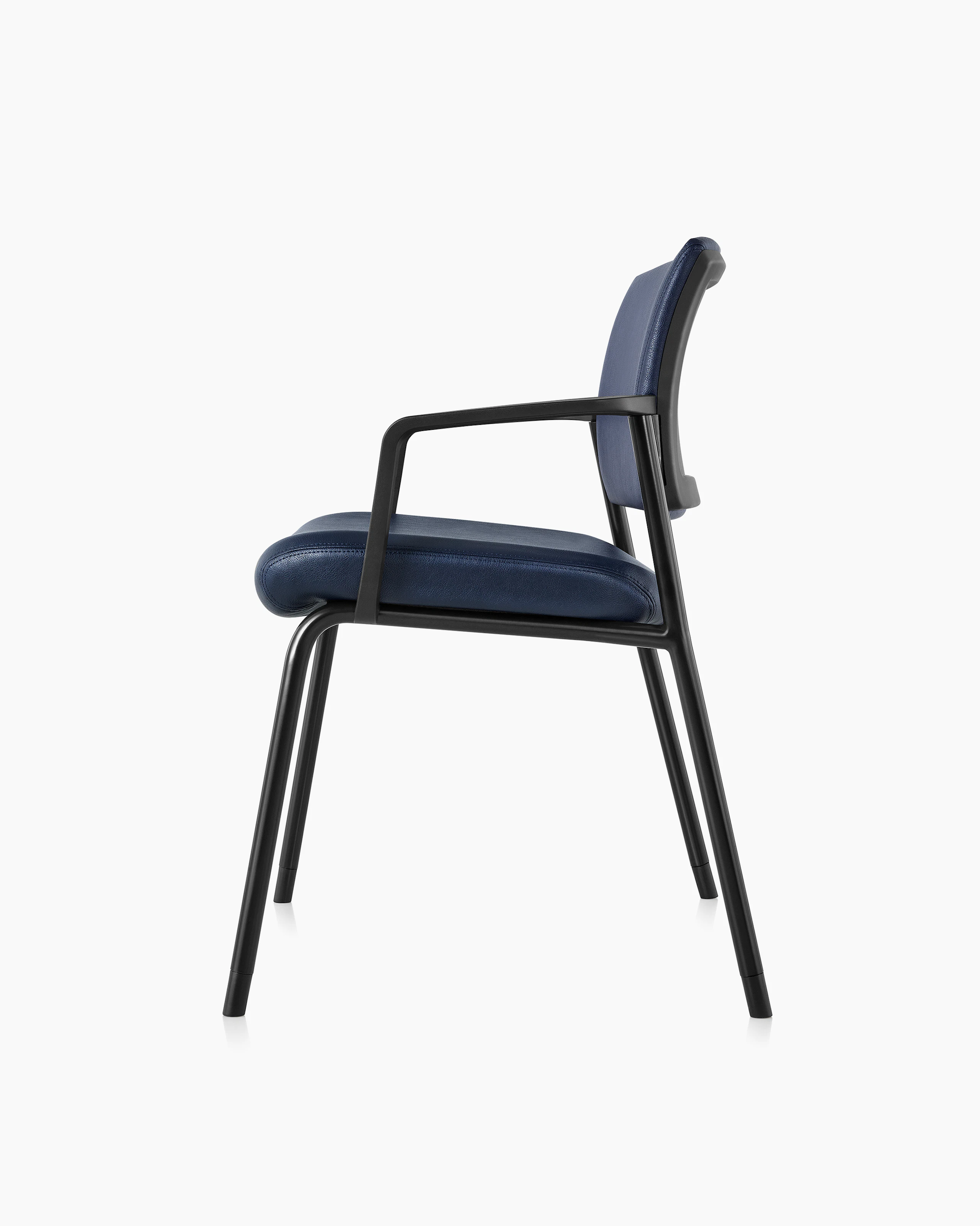 Side view of Verus Plus Chair with arms, in blue vinyl upholstery.