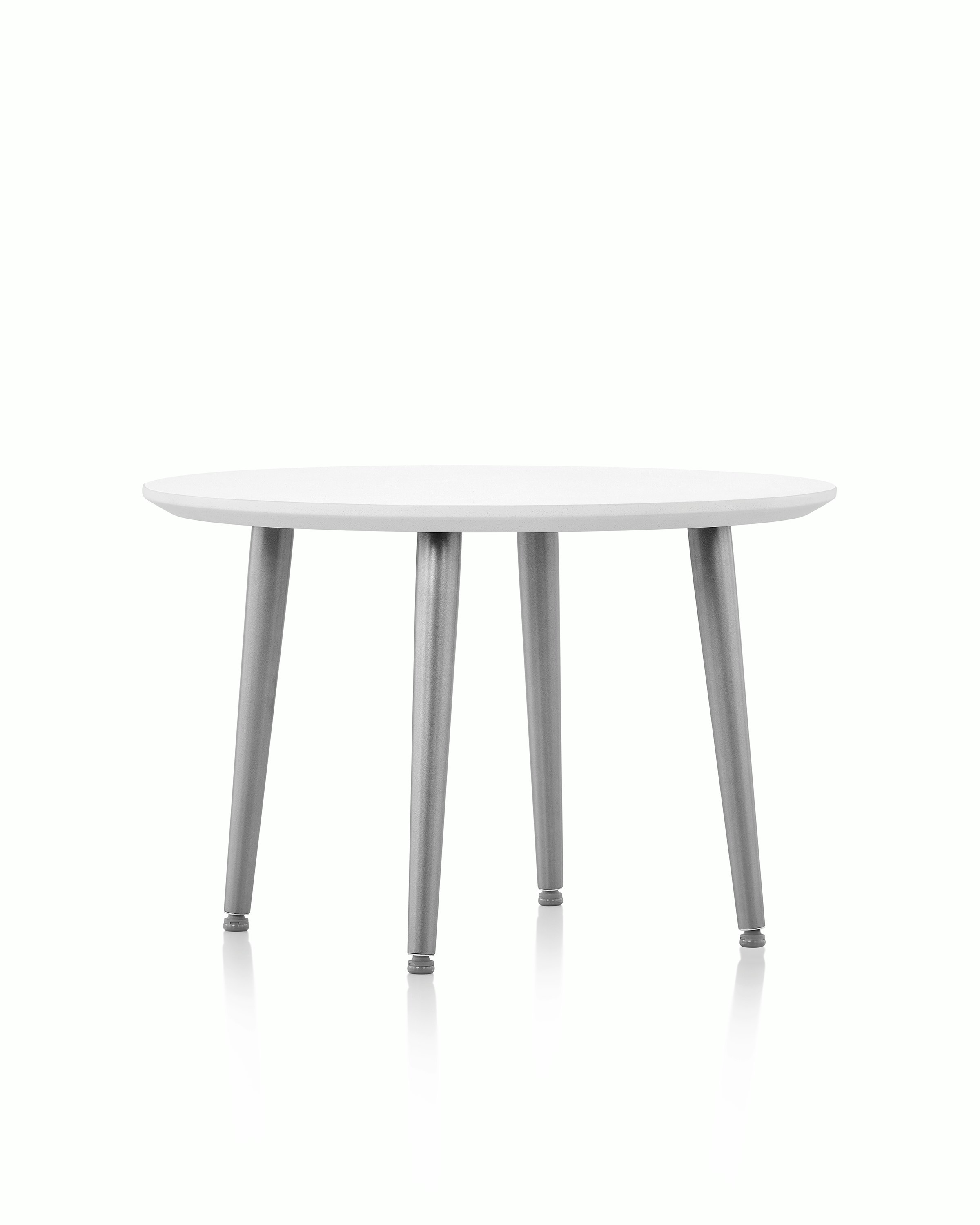 Palisade Occasional Table with metal legs and solid surface top on white sweep.
