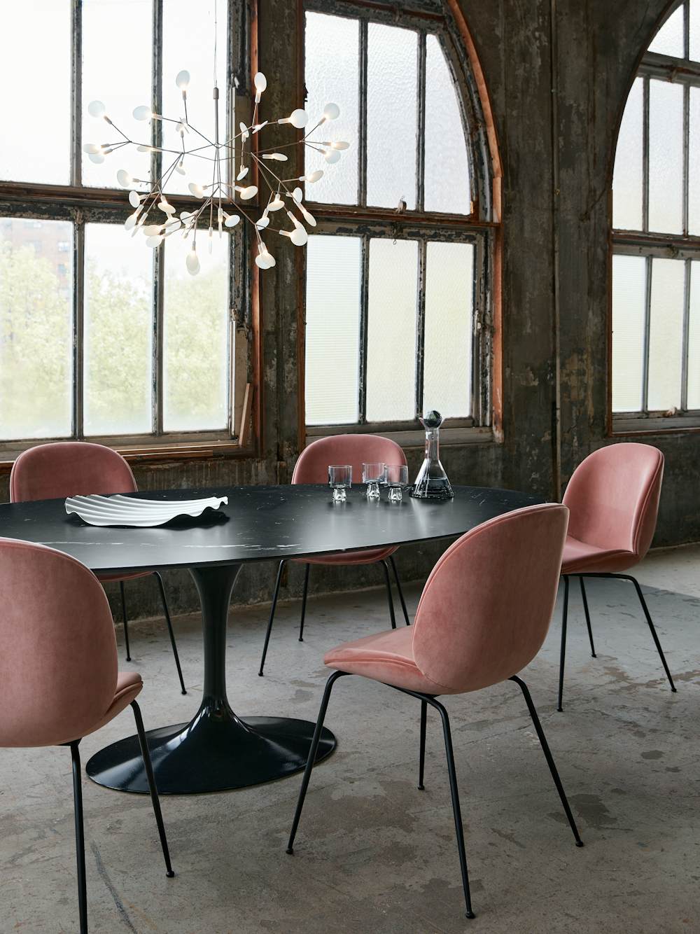 Heracleum II Pendant, Saarinen Dining Table and Beetle Chairs in a industrial loft dining room