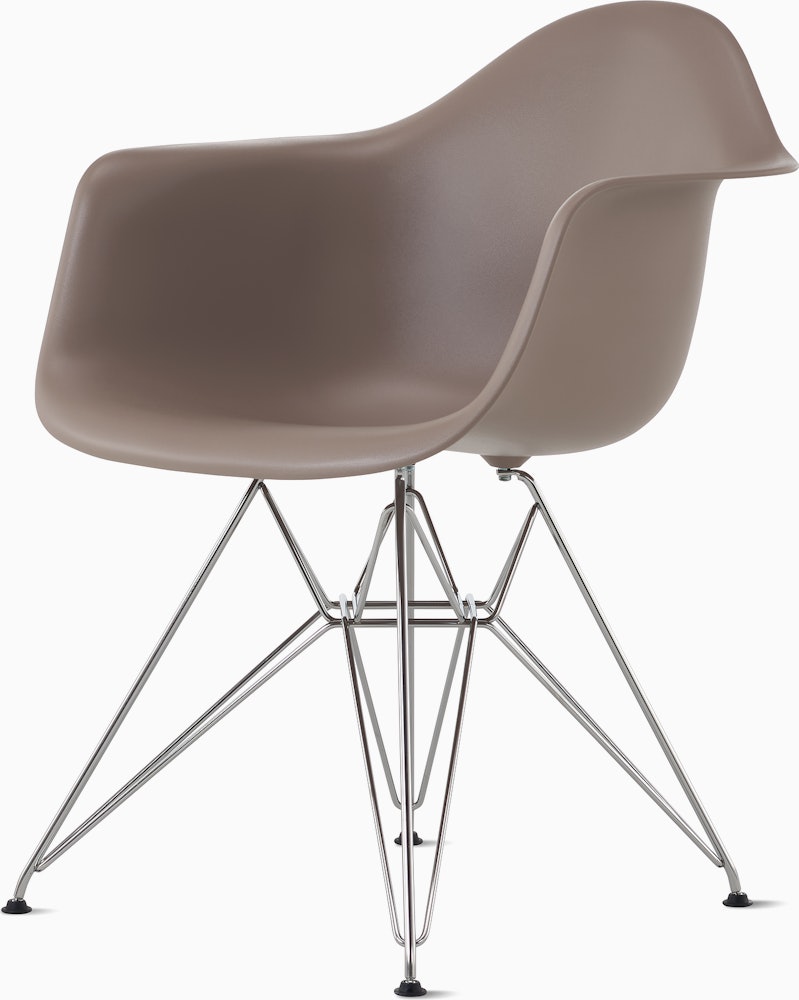 Side angle of cocoa plastic shell chair with wire base legs.