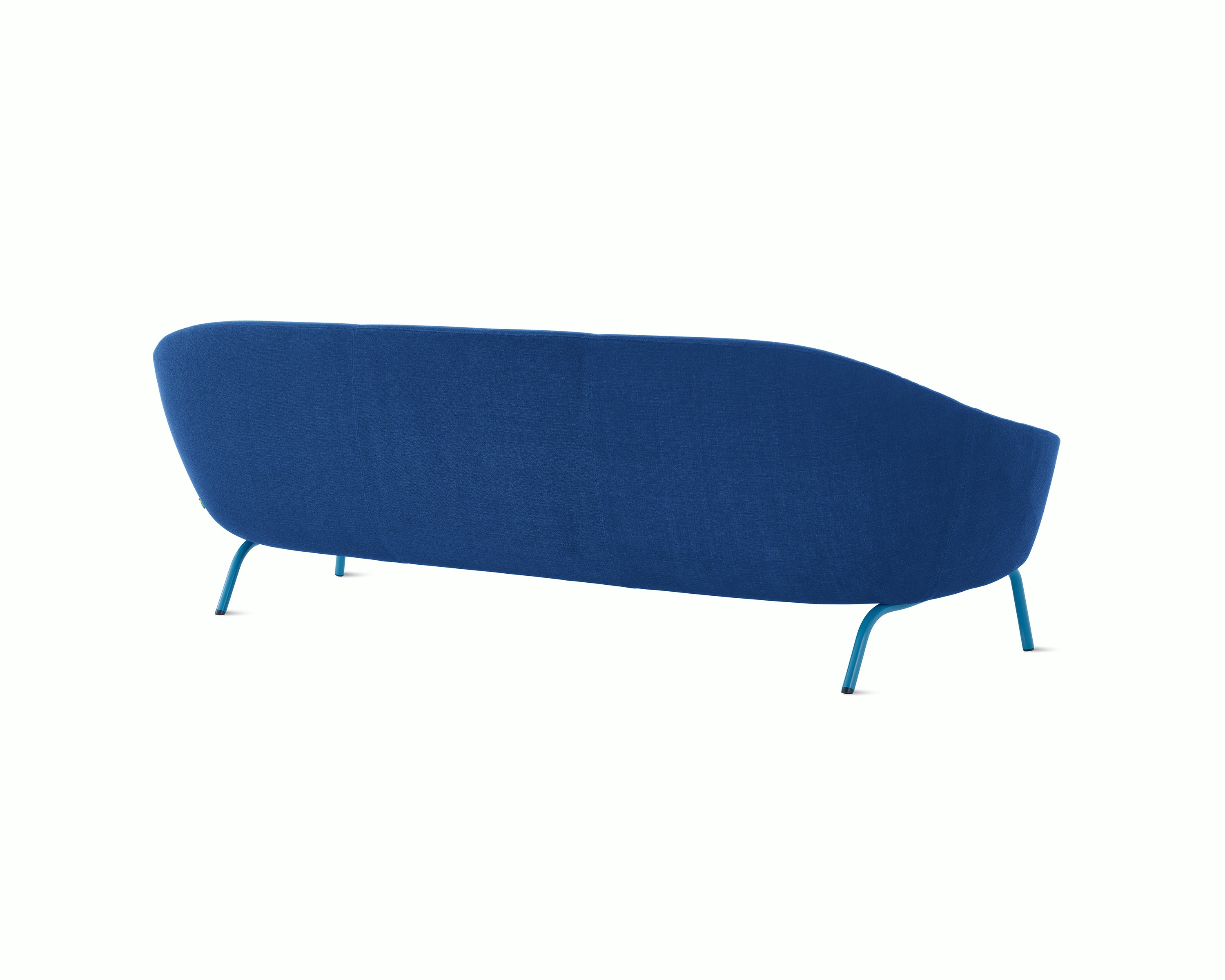 White sweep shot of dark blue upholstered Ever 3 seat sofa on pale blue steel legs.