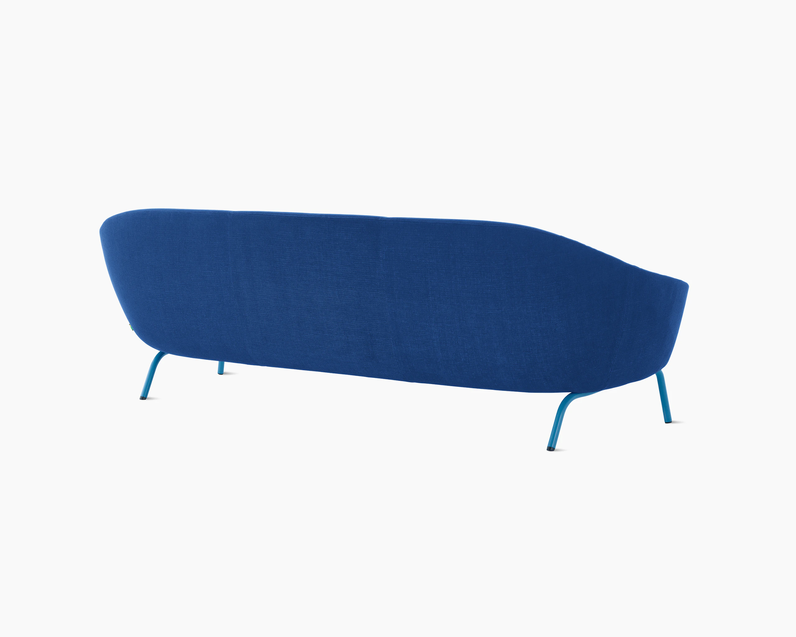 White sweep shot of dark blue upholstered Ever 3 seat sofa on pale blue steel legs.