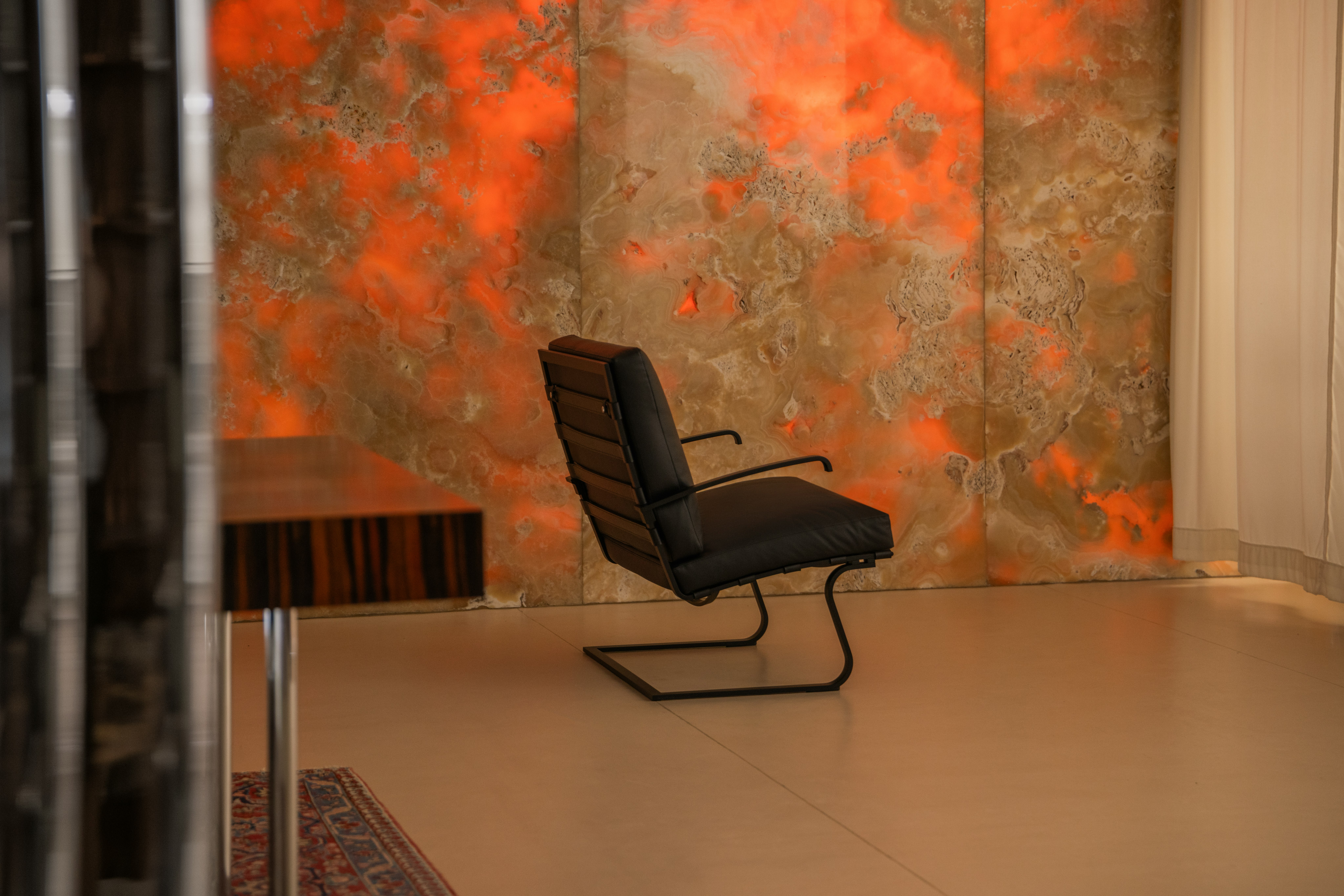Tugendhat Chair and onyx wall