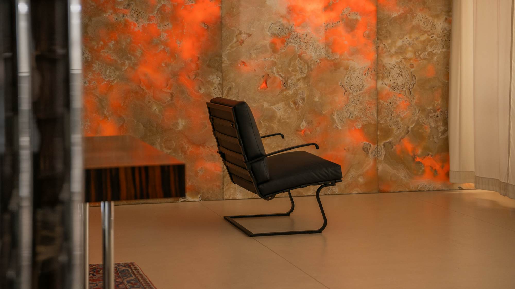Tugendhat Chair and onyx wall