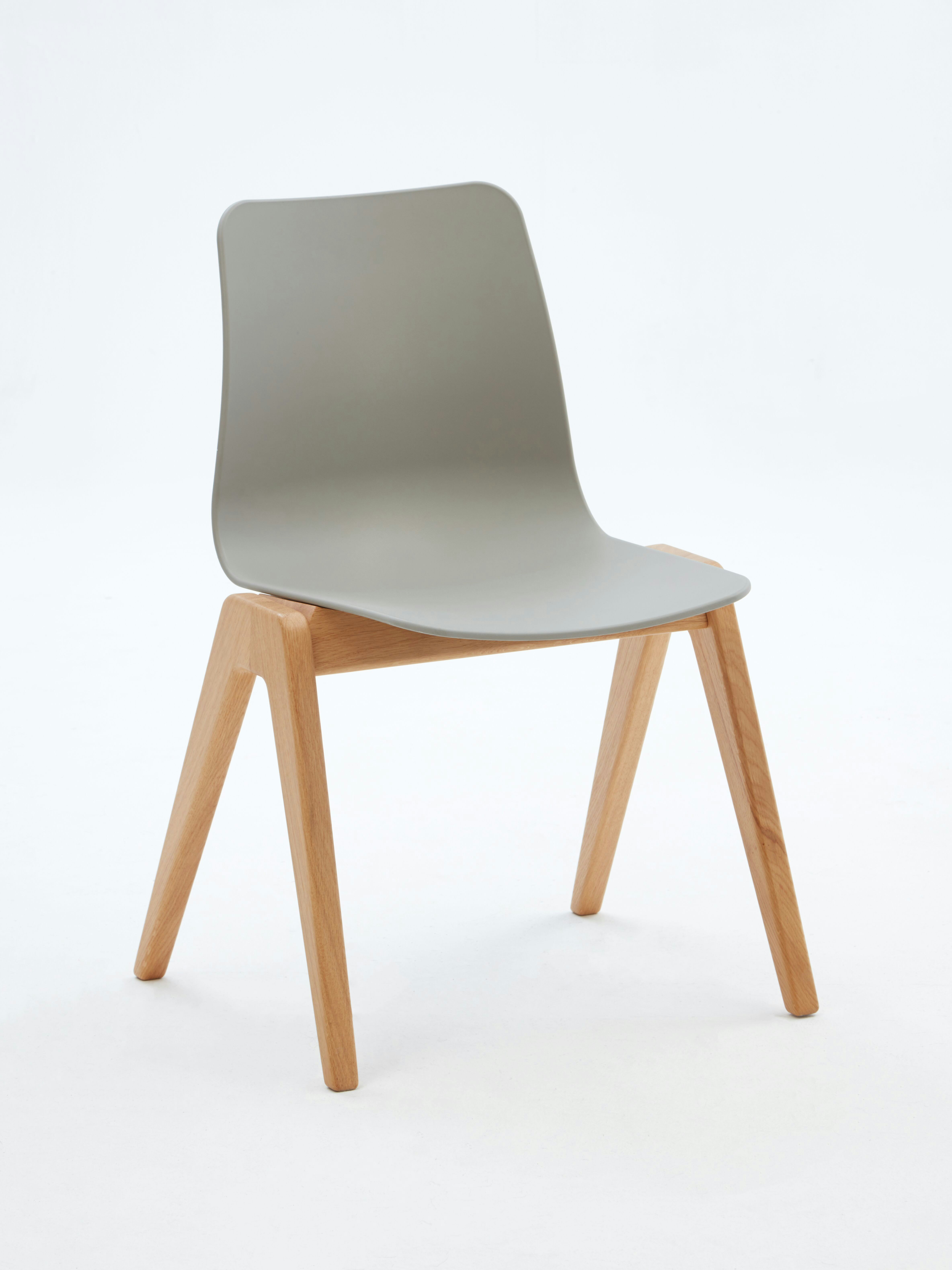 A gray naughtone Polly Wood Chair with an oak base, viewed at an angle.