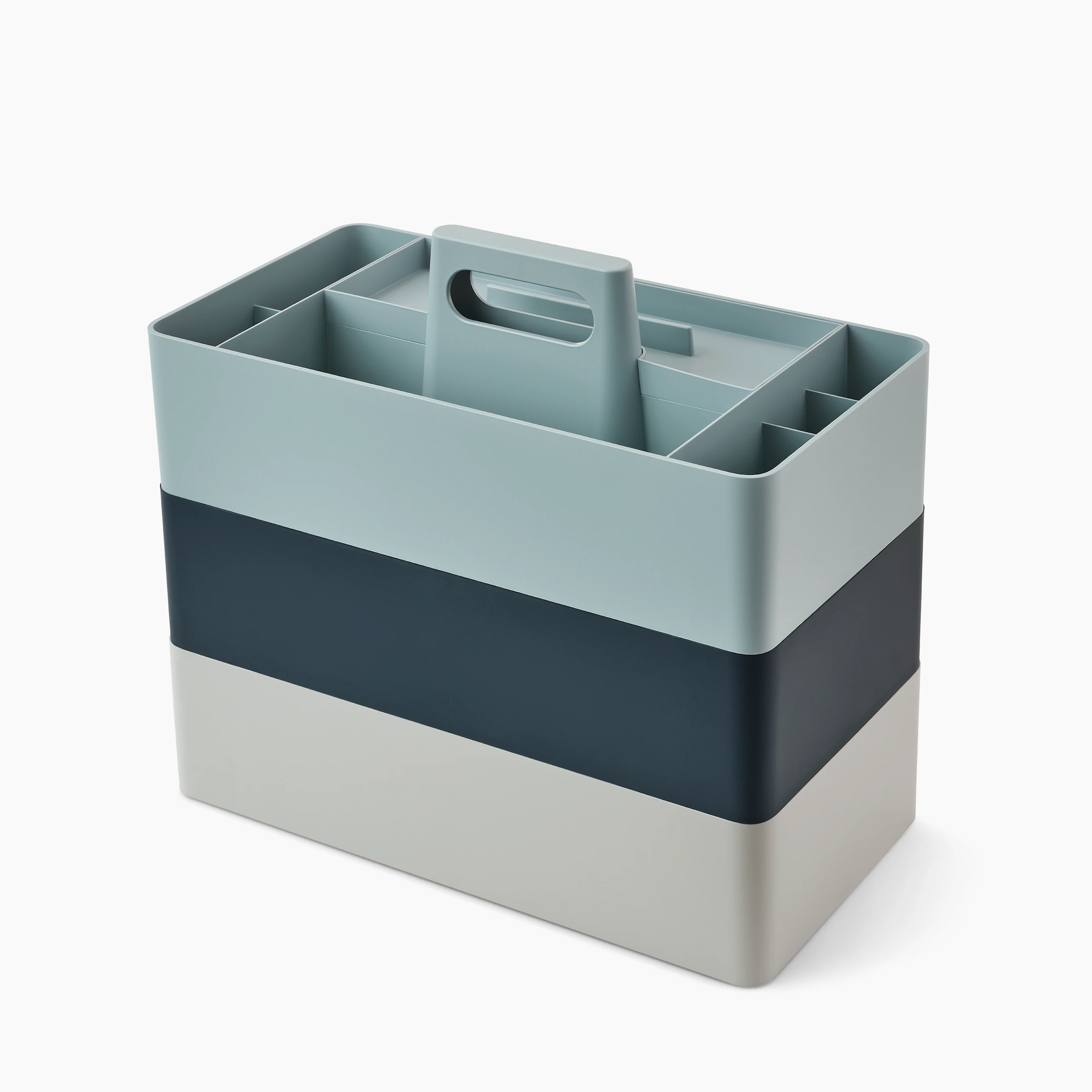 Grey, dark blue and light blue OE1 Workbox storage boxes stacked on top of each other, viewed from an angle.
