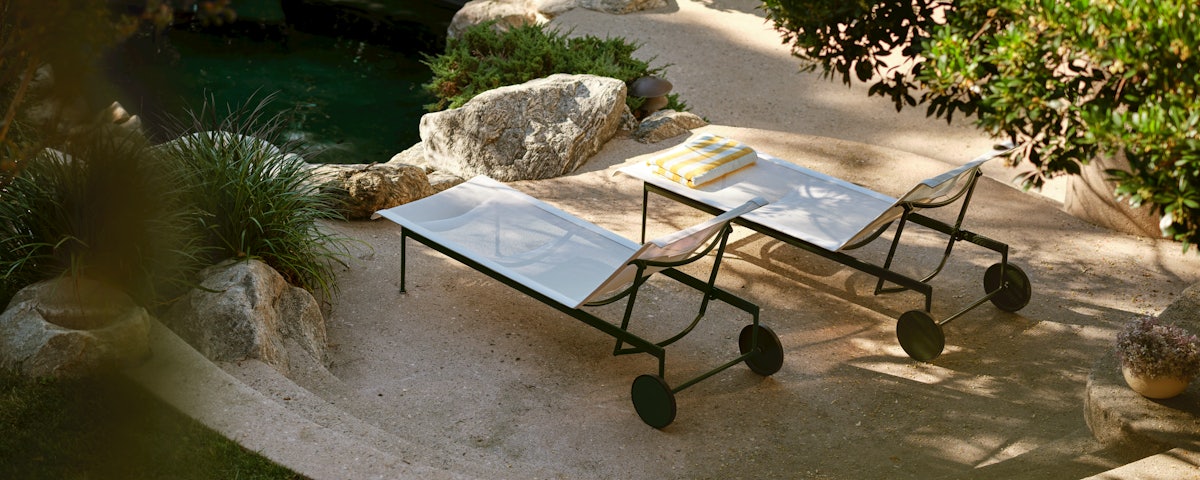 1966 Collection Adjustable Chaise Chairs at a poolside setting