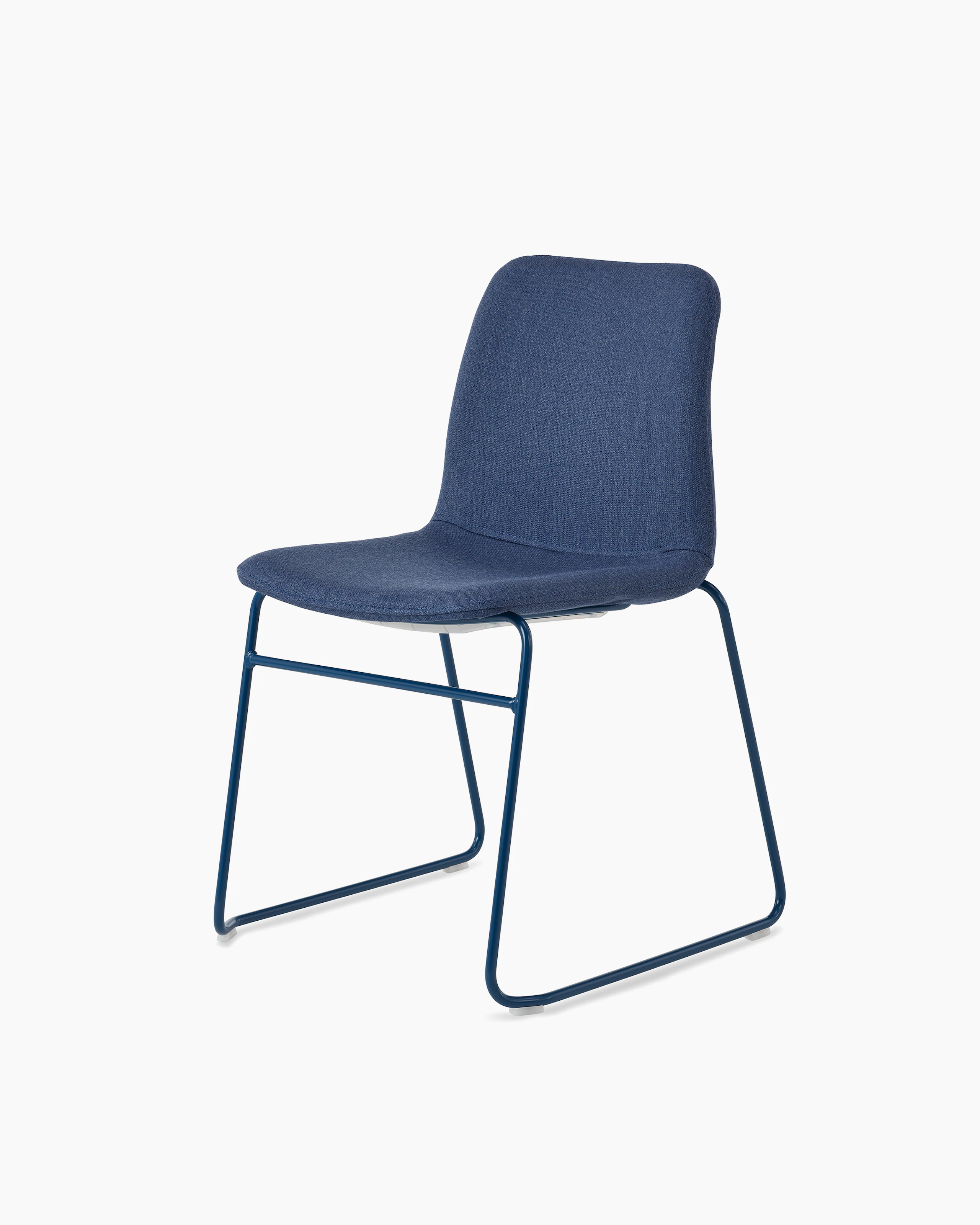 White sweep of Viv chair with dark blue fabric and dark blue steel sled base