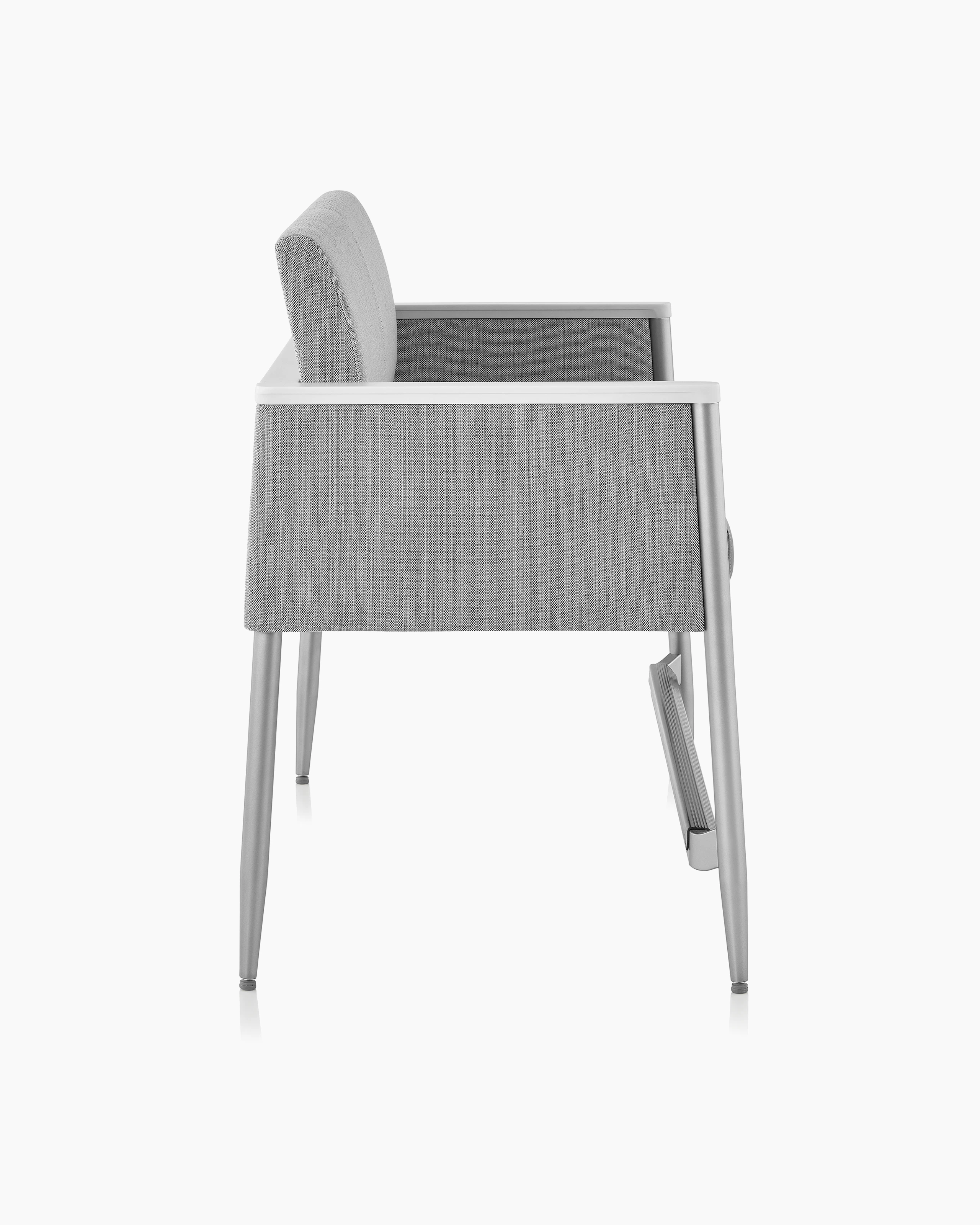 Nemschoff Palisade Easy Access Multiple Seating in a gray upholstery and white arm caps, viewed from the side.