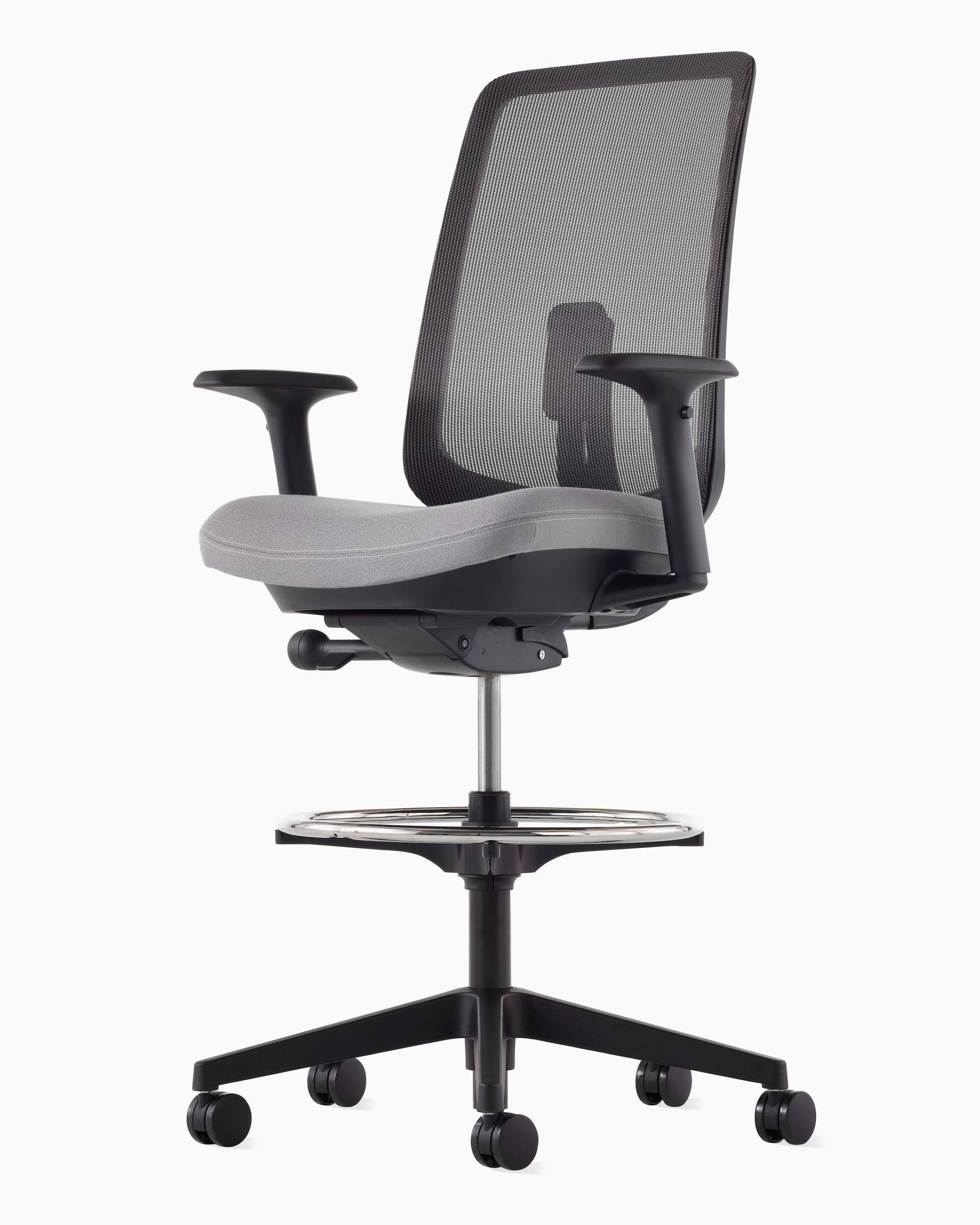 A black Verus Stool with a suspension back, grey seat and black frame viewed at an angle.