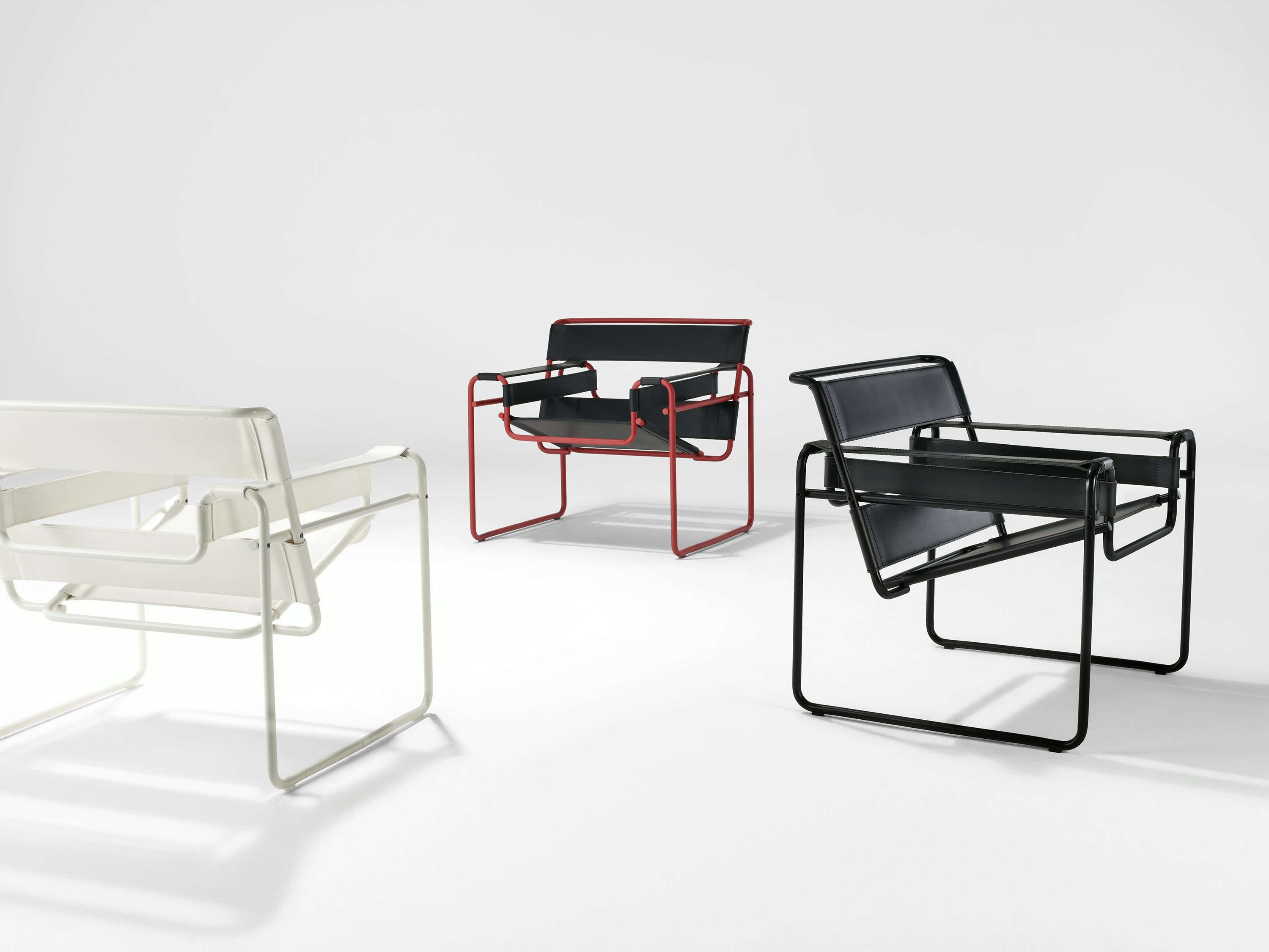 Wassily Chairs in white, dark red, and onyx
