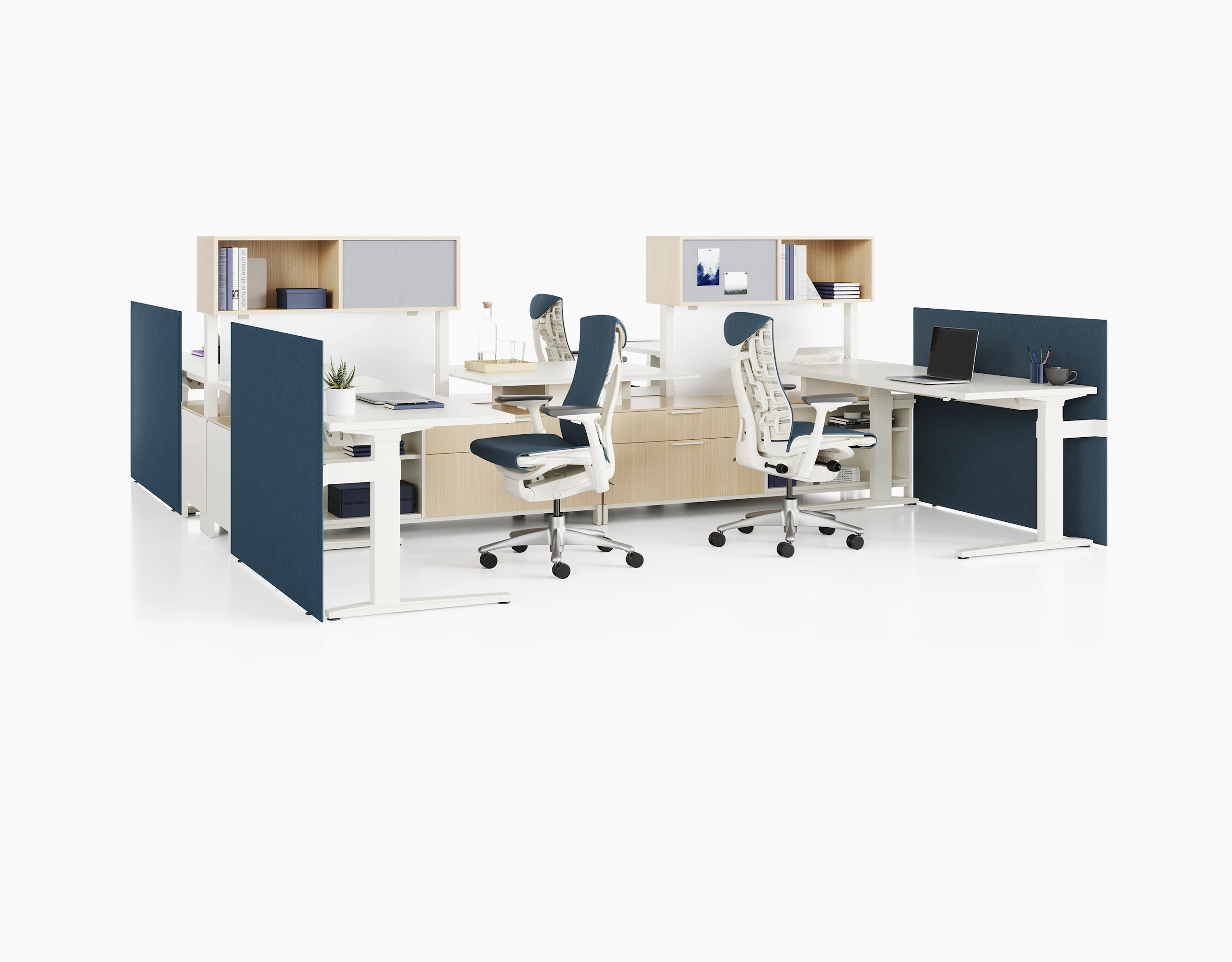Canvas Dock workstations with sit-to-stand tables, storage, blue screens, and blue Embody Chairs.