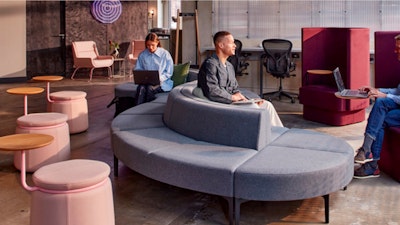 Reception area with Symbol Modular Seating, Lasso stools and Pullman Chairs, with Aeron chairs in the background.