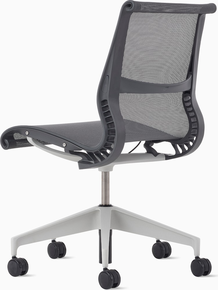 Rear angle view of a Setu chair without arms in grey.