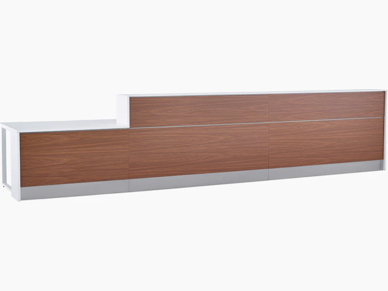 Prefab Commend Nurses Station for three with white Corian tops, walnut woodgrain laminate front and stainless steel toe kicks.