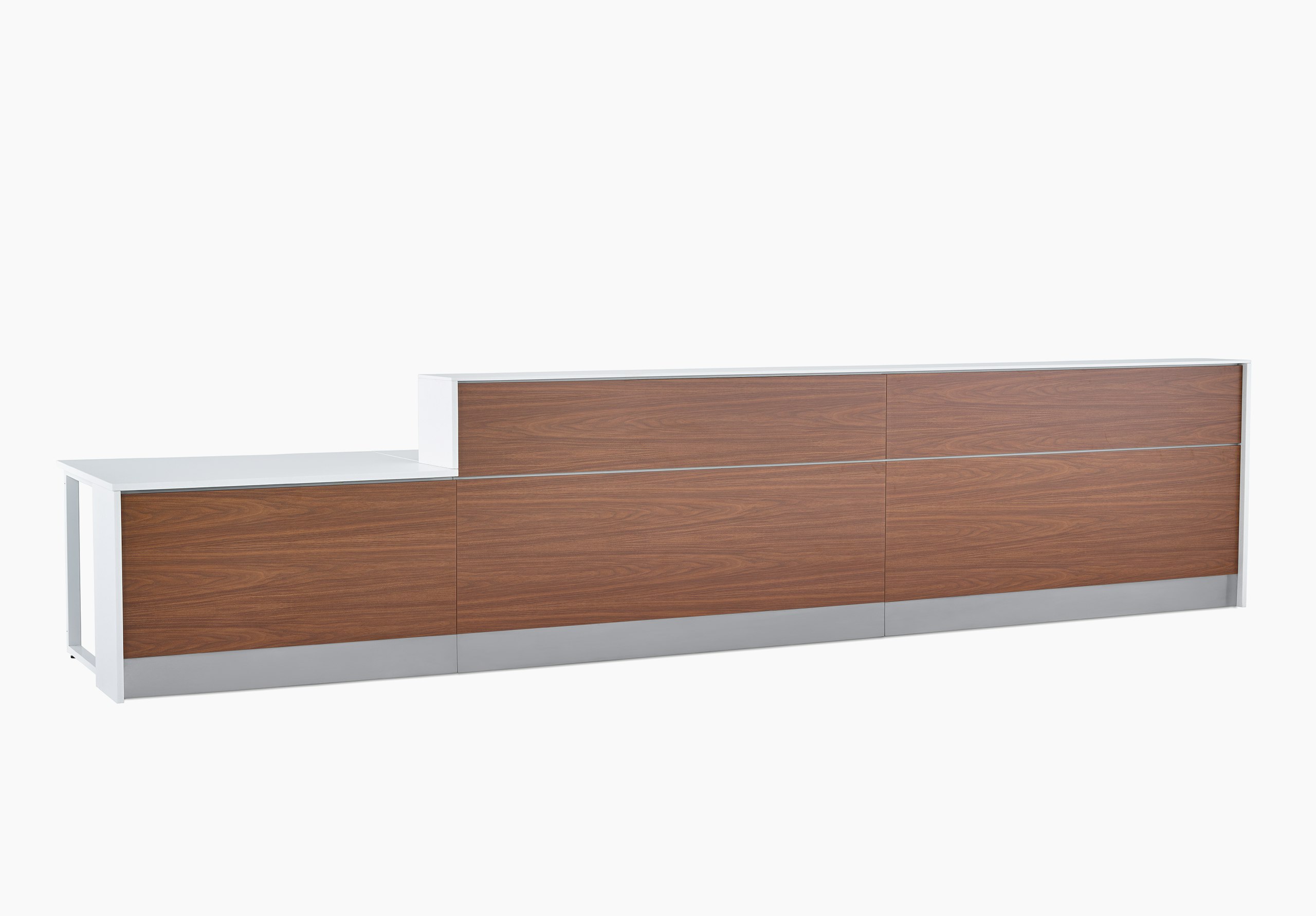 Prefab Commend Nurses Station for three with white Corian tops, walnut woodgrain laminate front and stainless steel toe kicks.