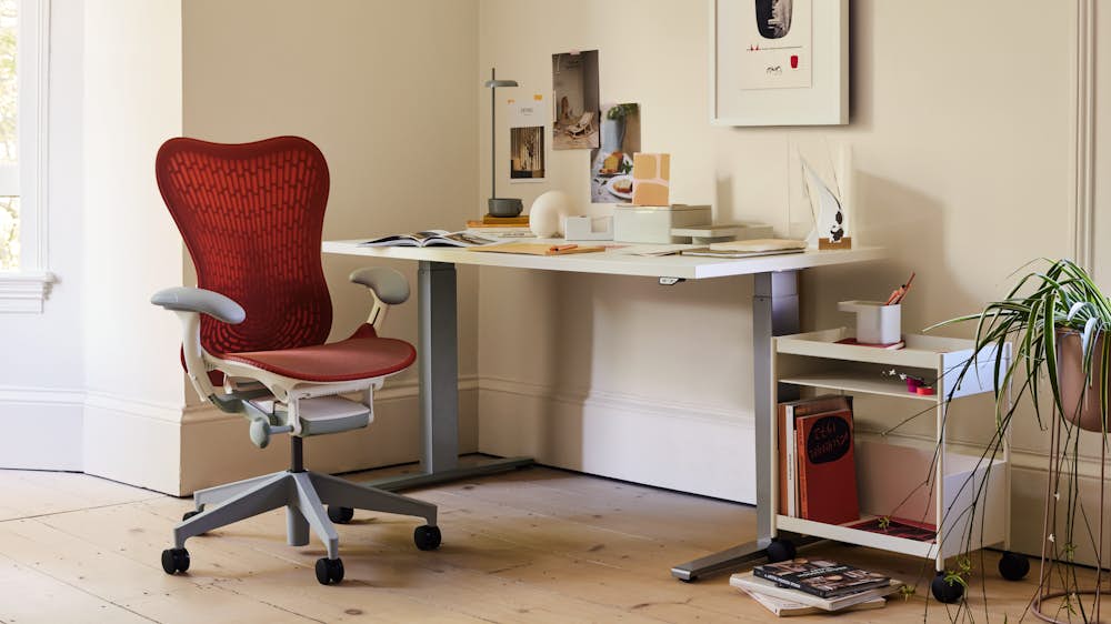 Full Loop Office Chair at a Leatherwrap Sit-to-Stand Desk home office setting, with the Full Loop Lounge and Geiger One floating credenza.