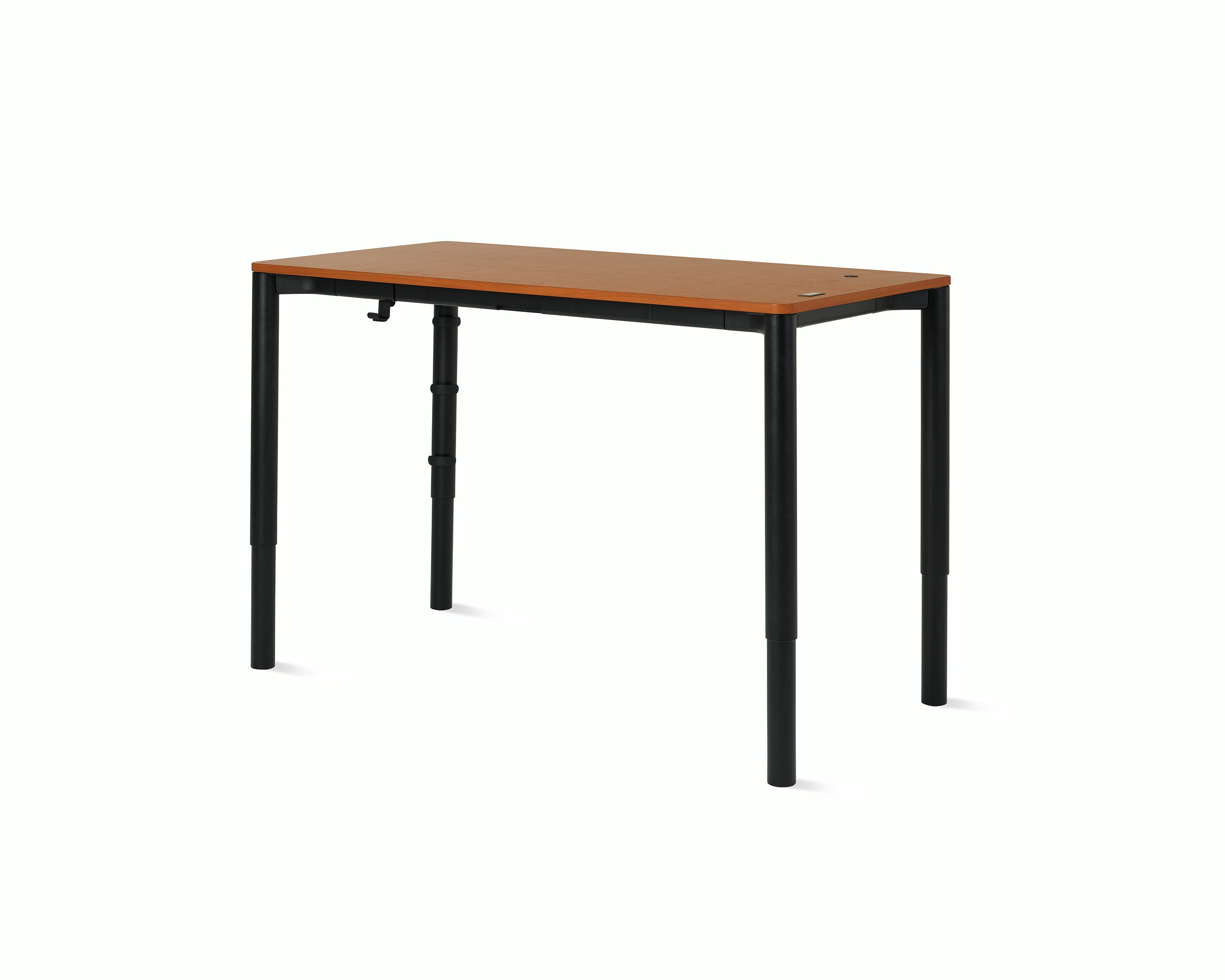Angle view of a four leg height-adjustable table shown at standing height with a dark woodgrain surface and black base.